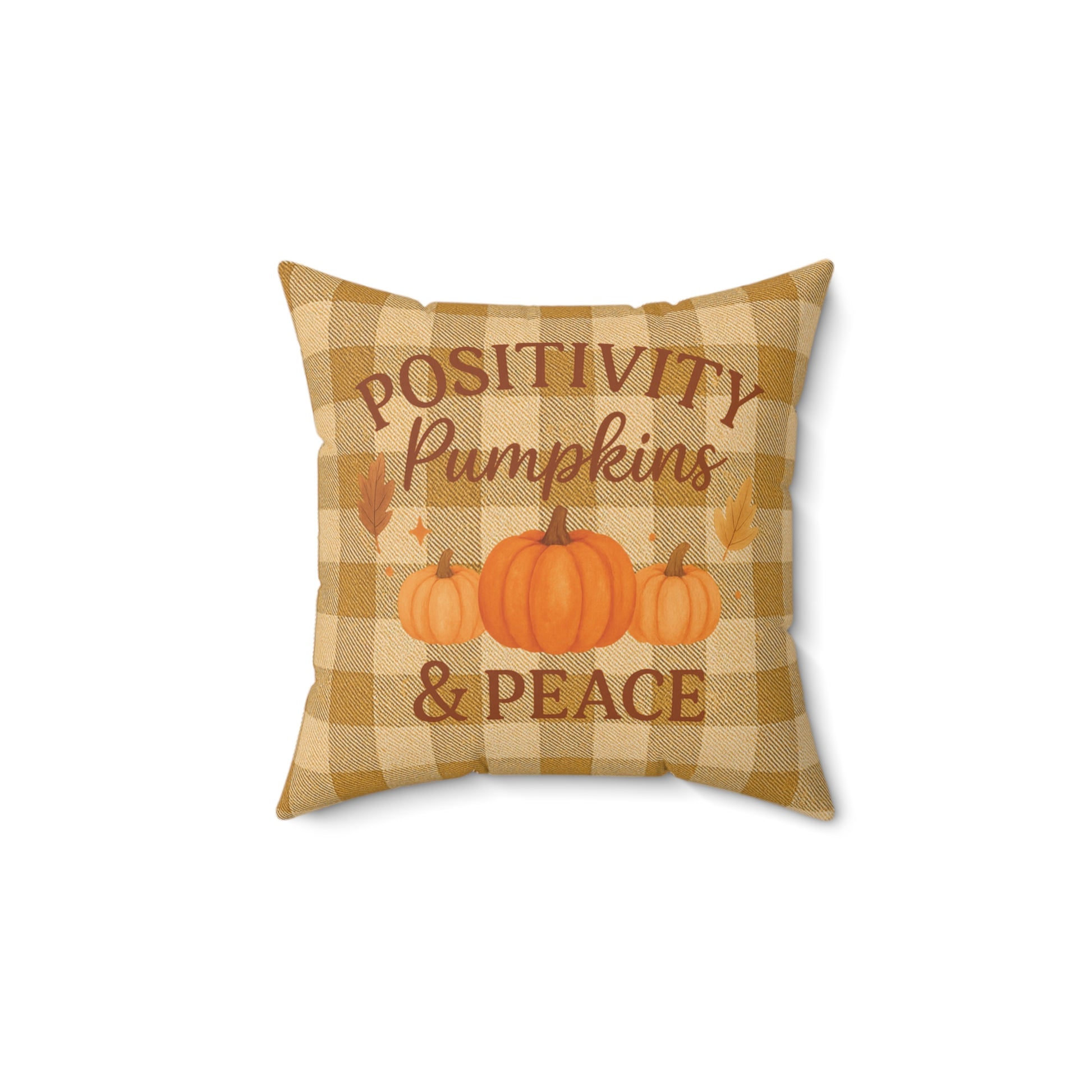 Decorative pillow with 'Positivity Pumpkins & Peace' text and pumpkin illustrations on a checkered background.