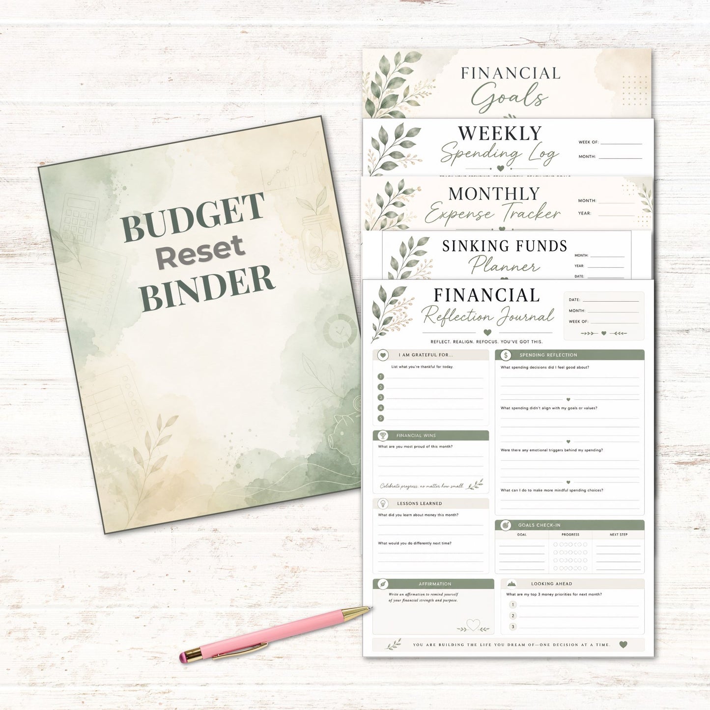 Budget reset binder with financial planning pages on a light wooden surface.