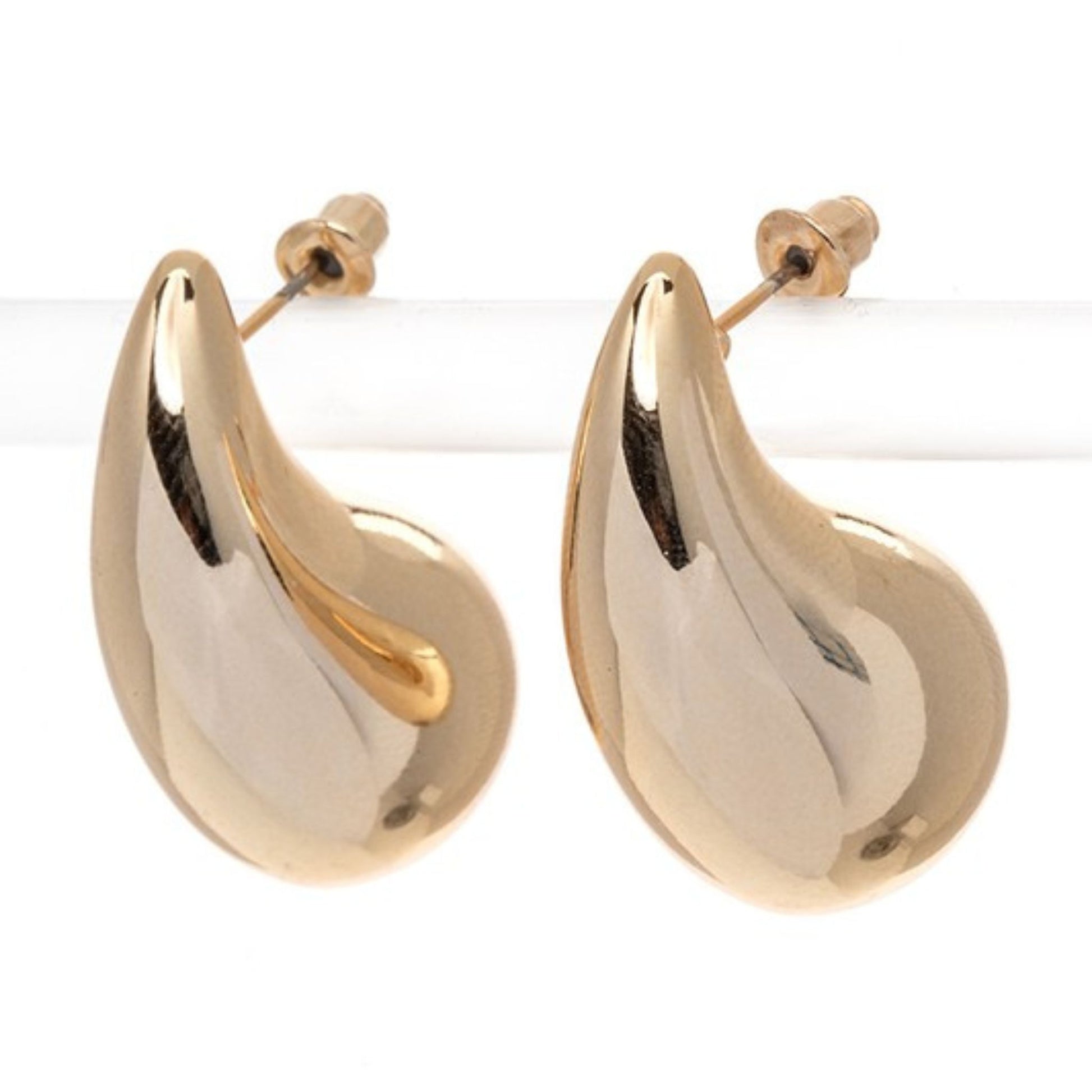 Gold hoop earrings on a white background