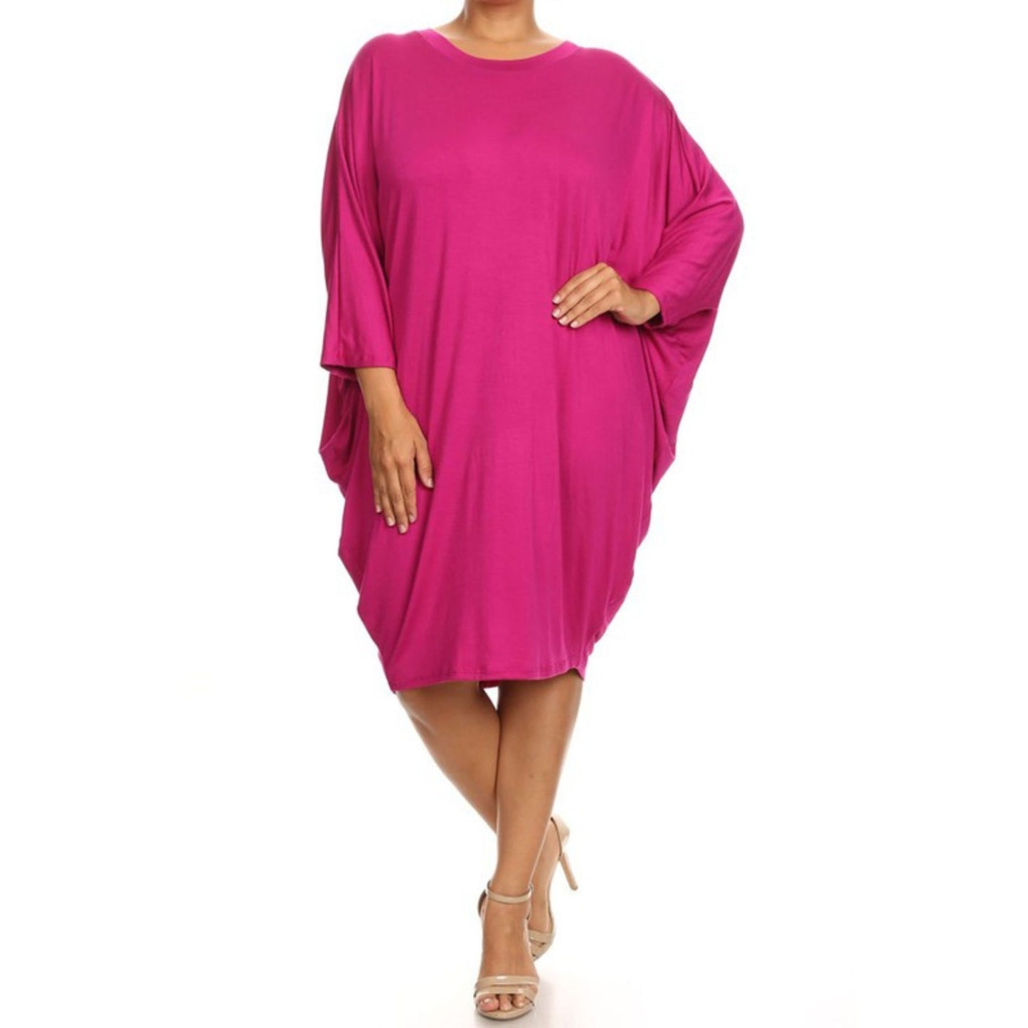 Pink dress worn by a model on a white background