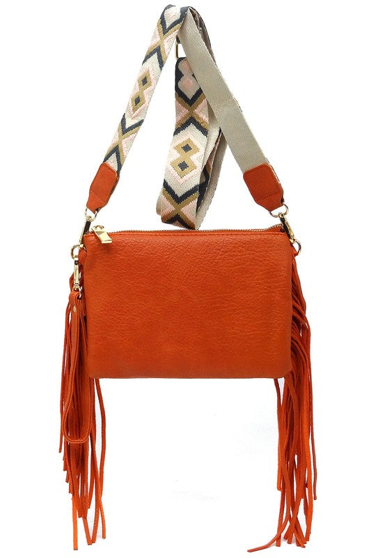 Rust Aztec Guitar Strap Fringe Clutch Crossbody in hanging position