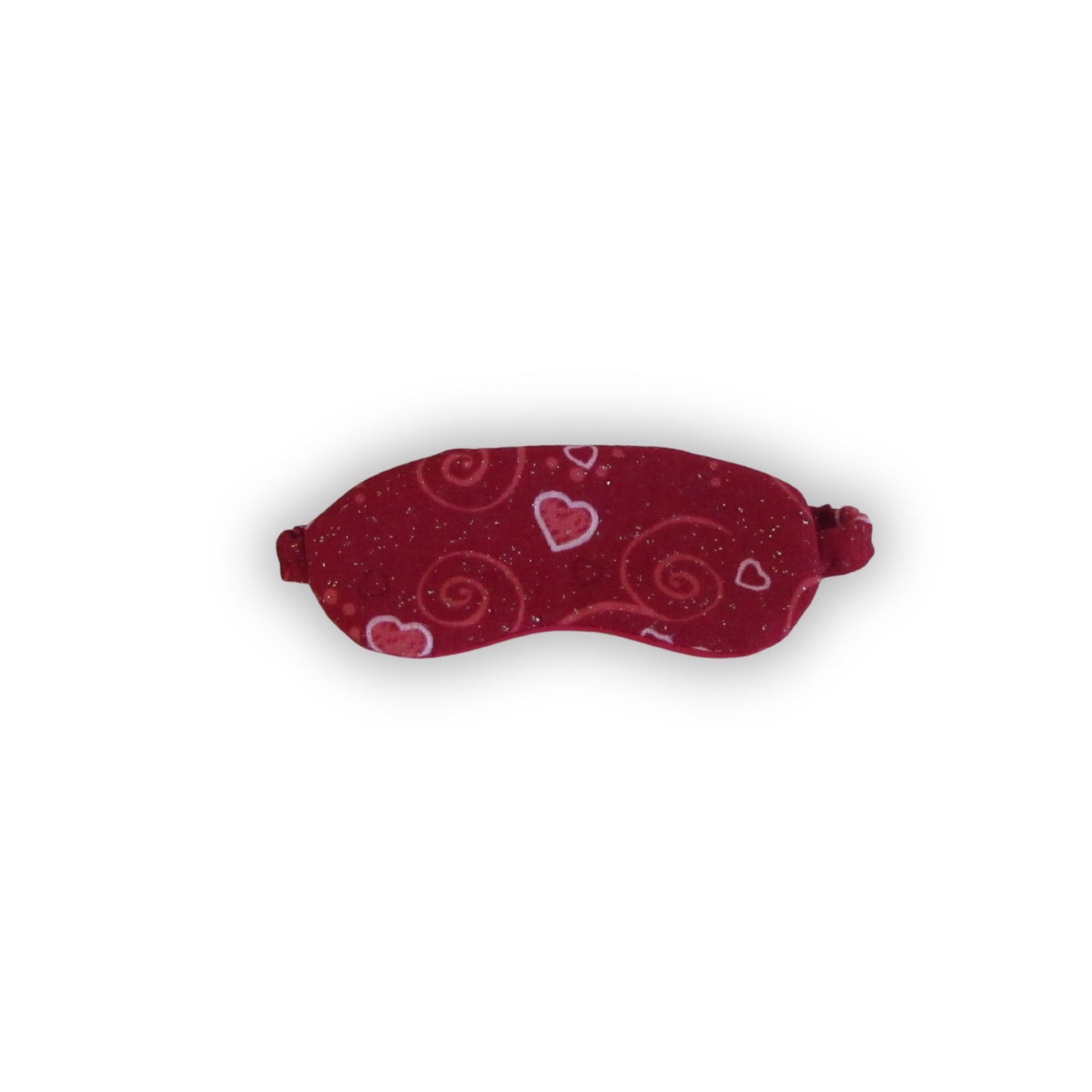 Red sleep mask with heart and swirl patterns on a white background