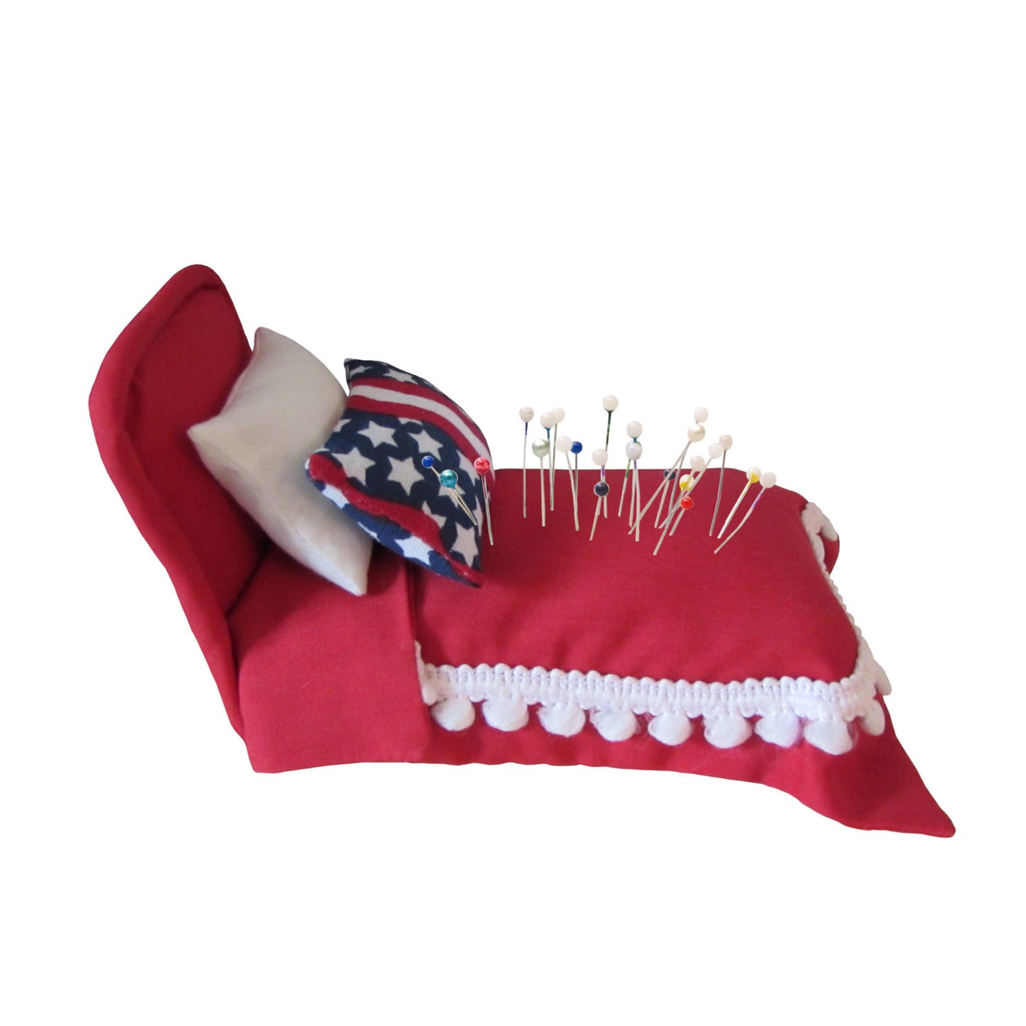Red Pincushion Bed with Stars and Stripes Pillow Side view with pins