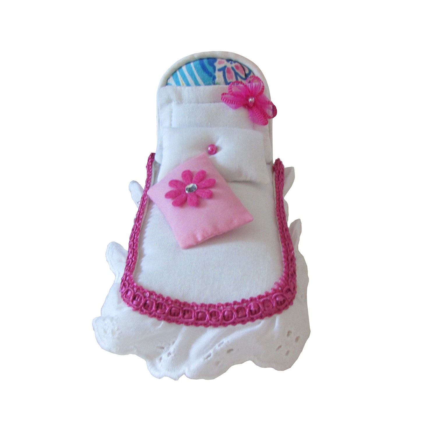 White Pincushion Bed with Pink-Trimmed Bedding Front view