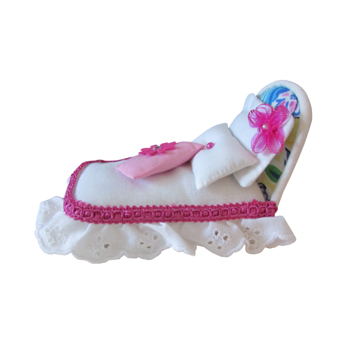 White Pincushion Bed with Pink-Trimmed Bedding Side view 2