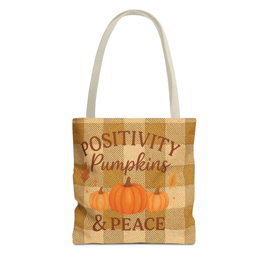 Tote bag with plaid pattern, pumpkins, and text on a white background
