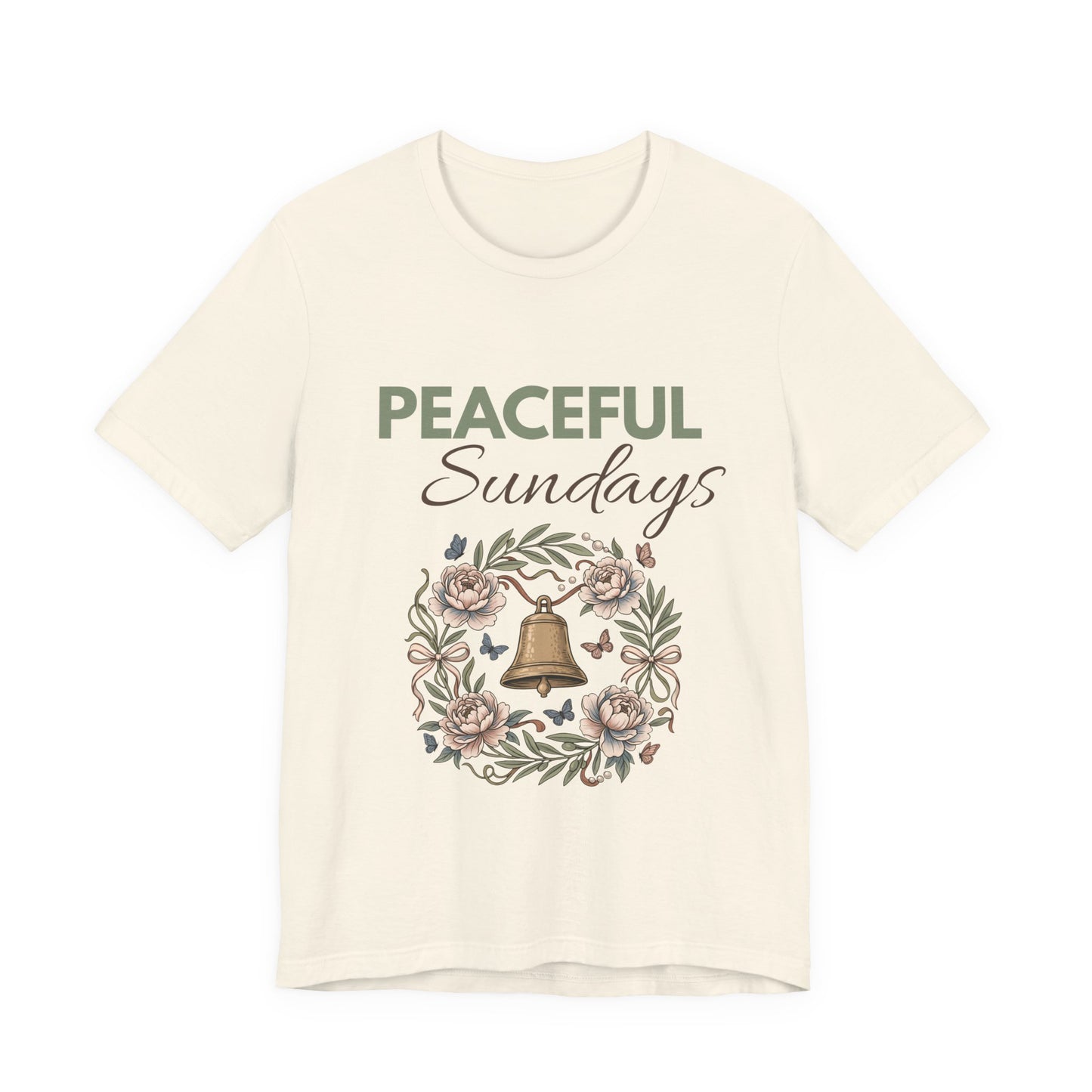 A natural colored t-shirt with 'Peaceful Sundays' design featuring a bell and flowers on a white background