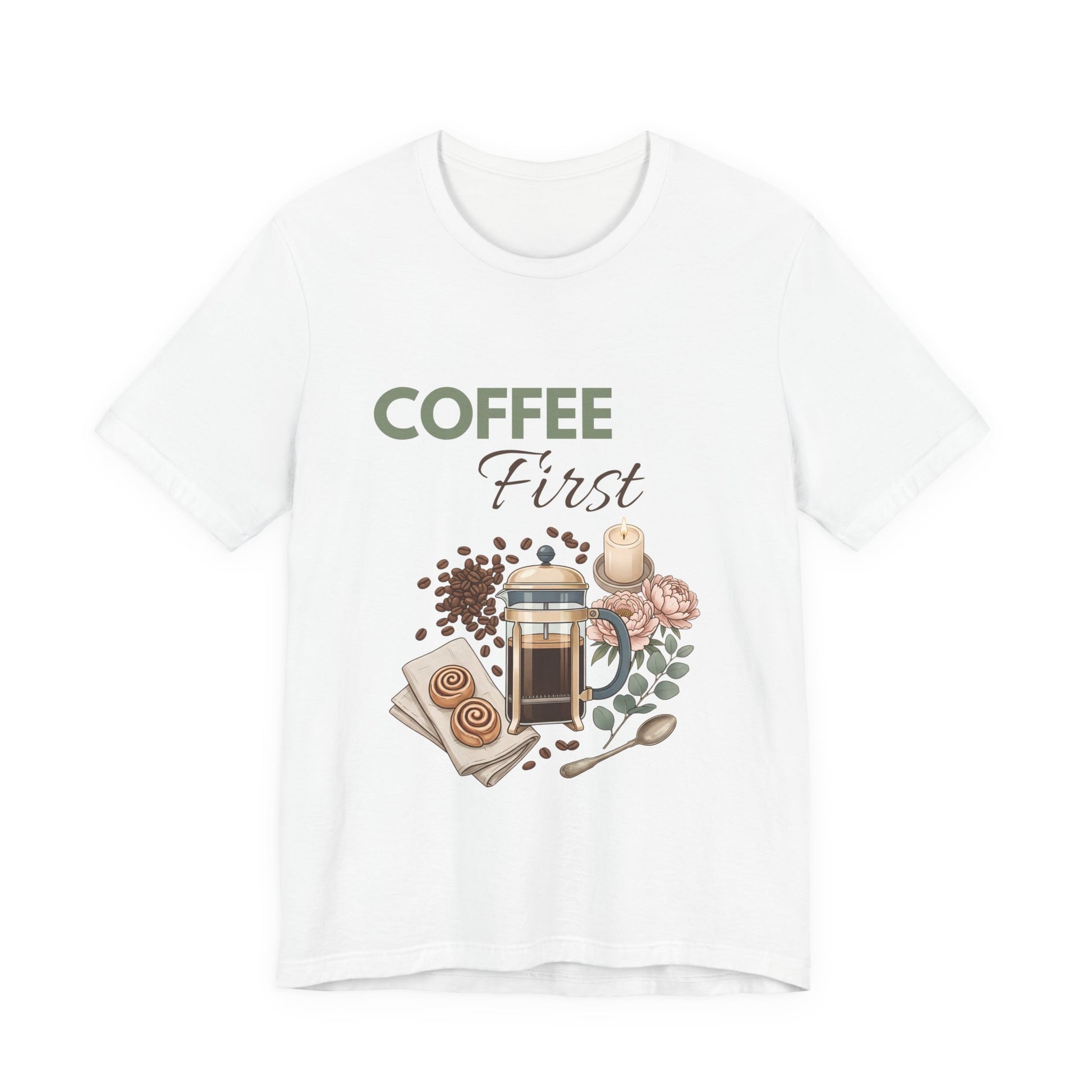 White t-shirt with 'Coffee First' graphic design featuring a coffee press, coffee beans, and flowers on a white background.