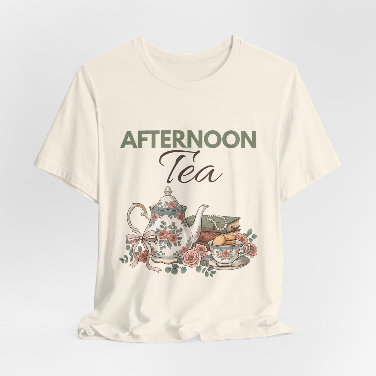 A hanging natural colored t-shirt with 'AFTERNOON Tea' on the front.