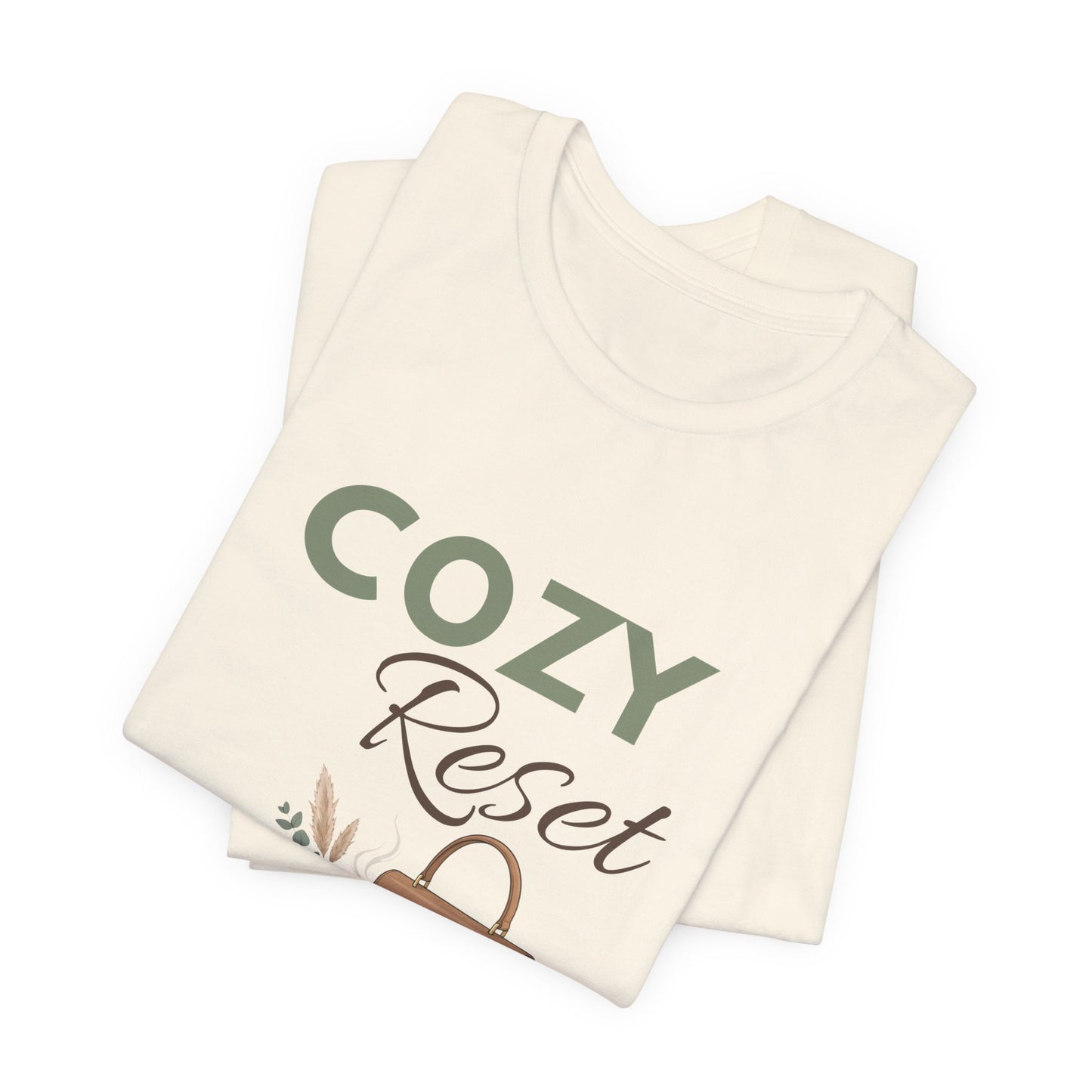 A folded t-shirt with 'COZY Reset' on the front.