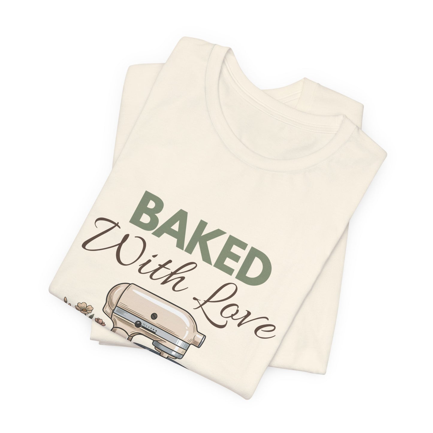 A folded t-shirt with 'BAKED With Love' on the front.