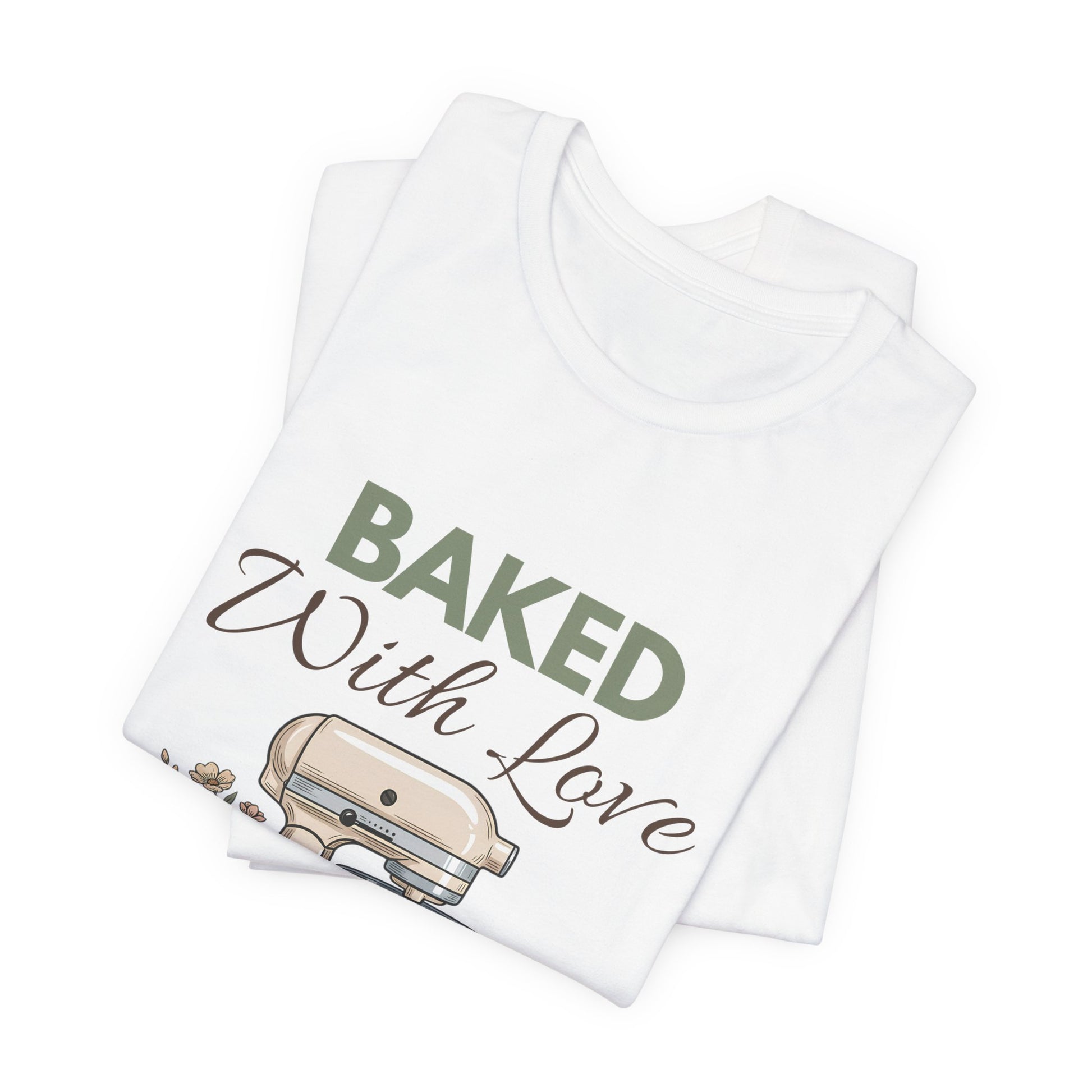 A folded t-shirt with 'BAKED With Love' on the front.
