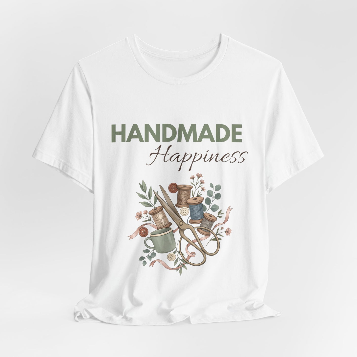 A hanging white t-shirt with 'HANDMADE Happiness' on the front.