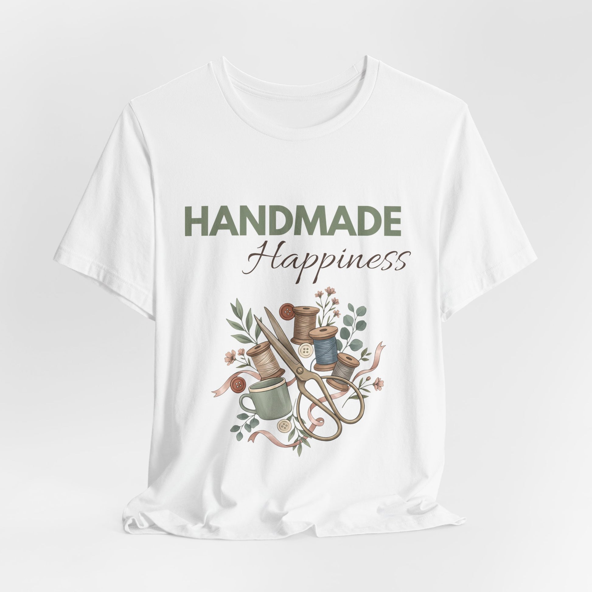 A hanging white t-shirt with 'HANDMADE Happiness' on the front.