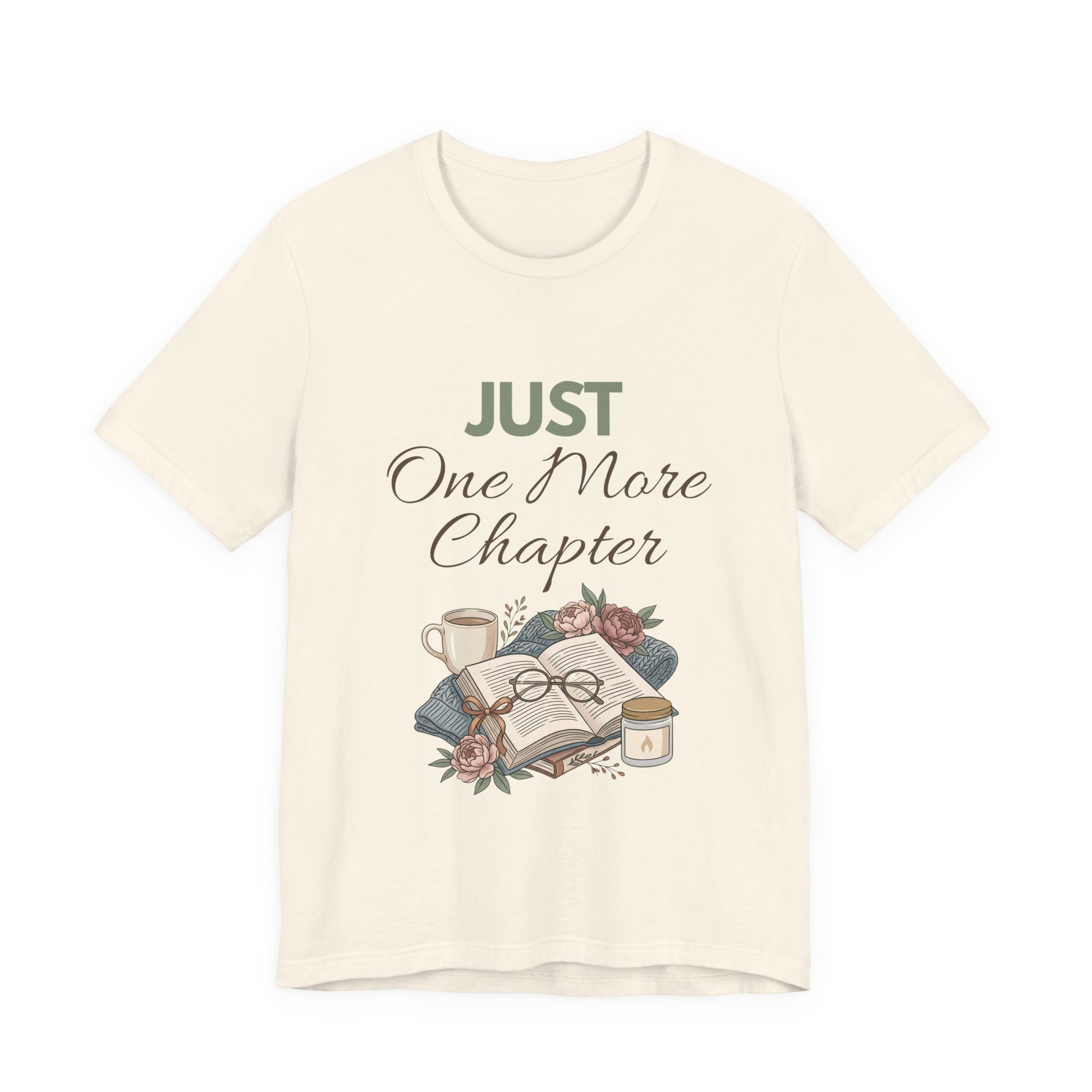 Natural colored t-shirt with 'Just One More Chapter' text and book-themed graphic on a white background
