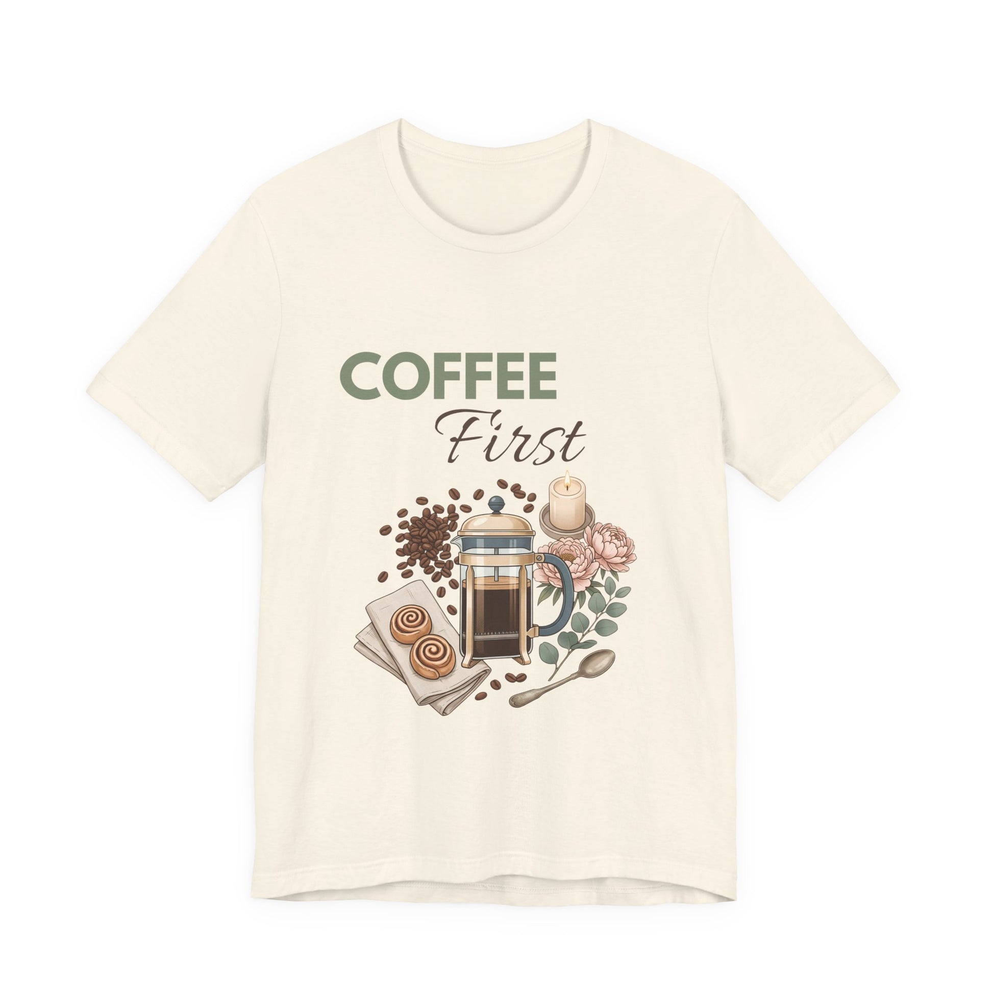 Natural colored t-shirt with 'Coffee First' graphic design on a white background