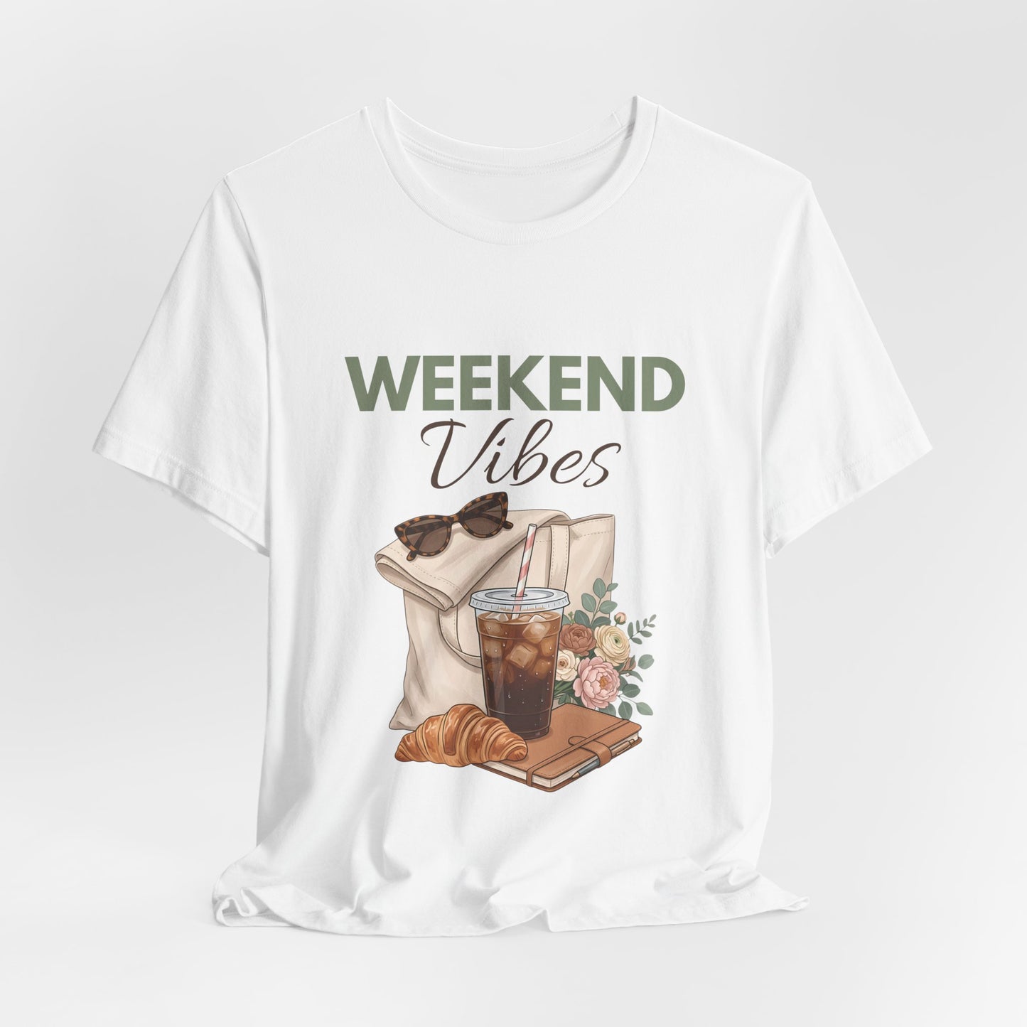 White t-shirt with 'Weekend Vibes' graphic featuring a coffee cup, croissant, and sunglasses on a white background