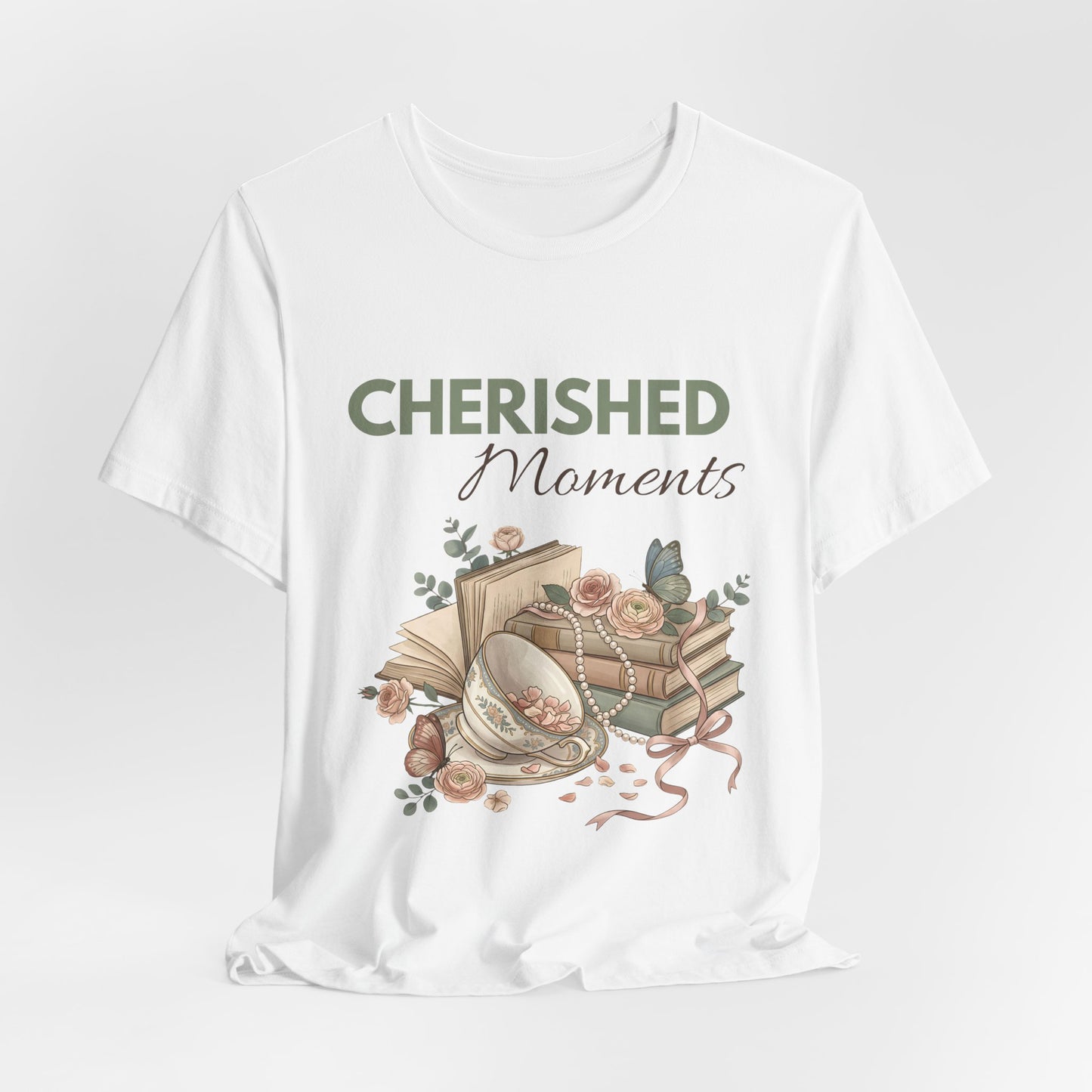 A hanging white t-shirt with 'CHERISHED Moments' on the front.