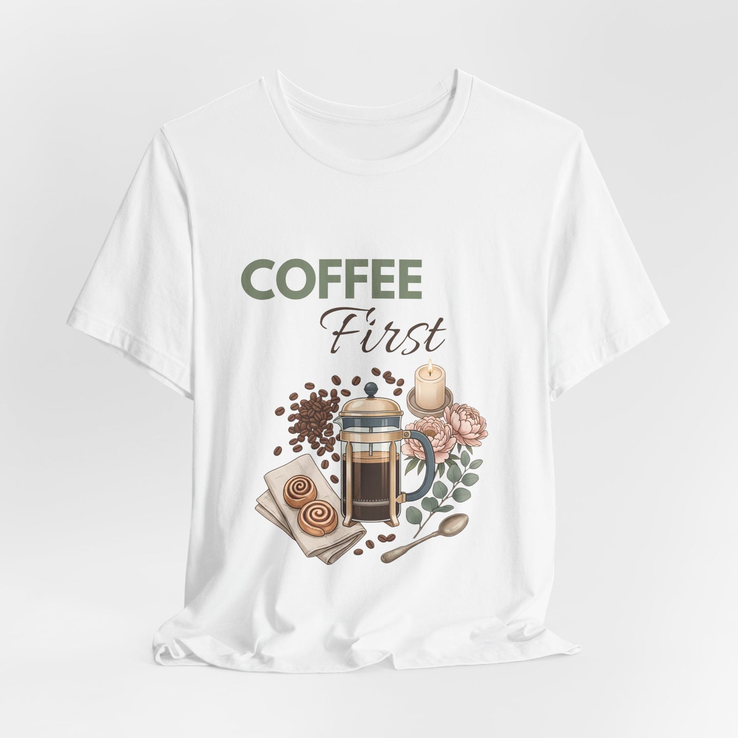 White t-shirt with coffee-themed graphic and 'Coffee First' text on a white background