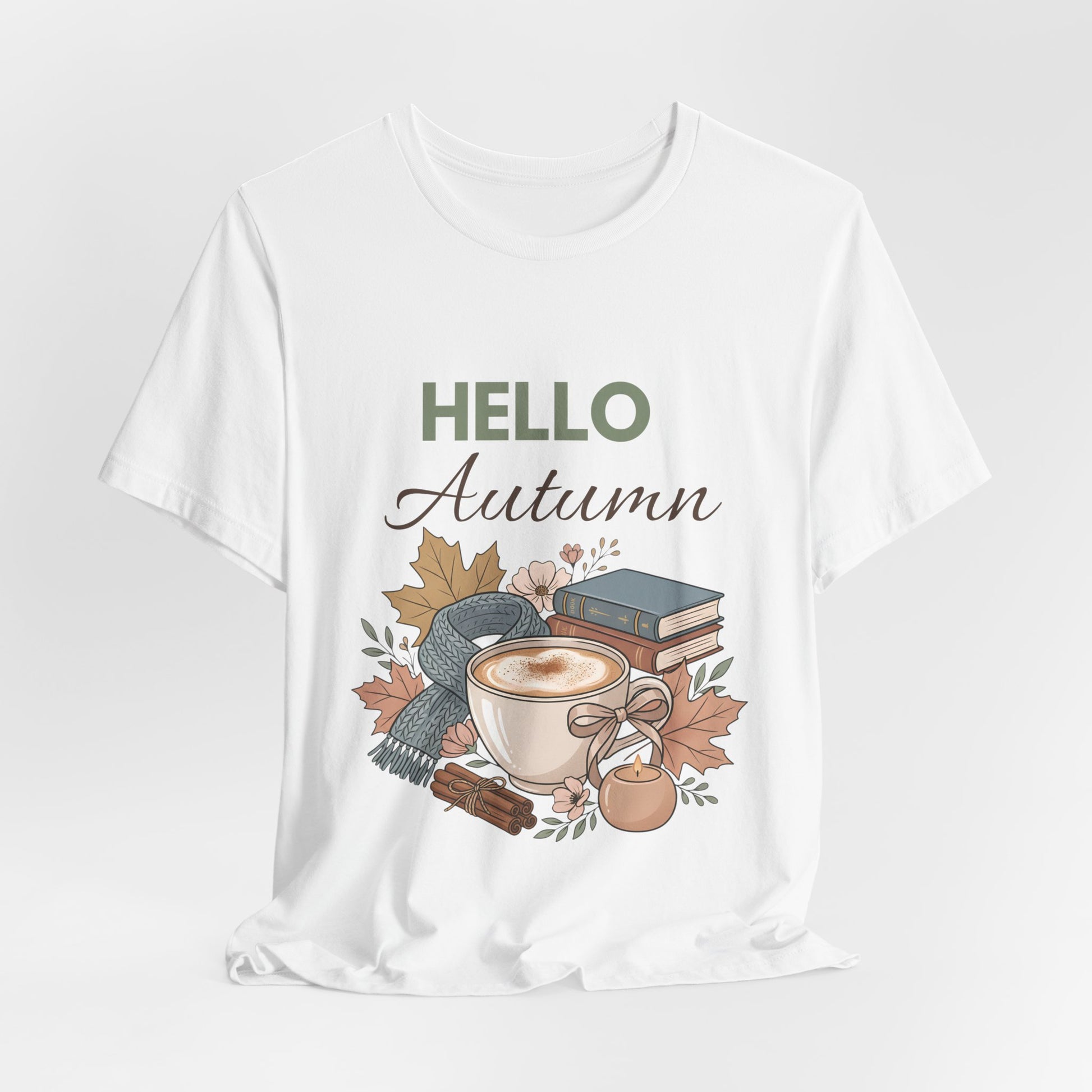 White t-shirt with 'Hello Autumn' design featuring a cup, leaves, and books on a white background