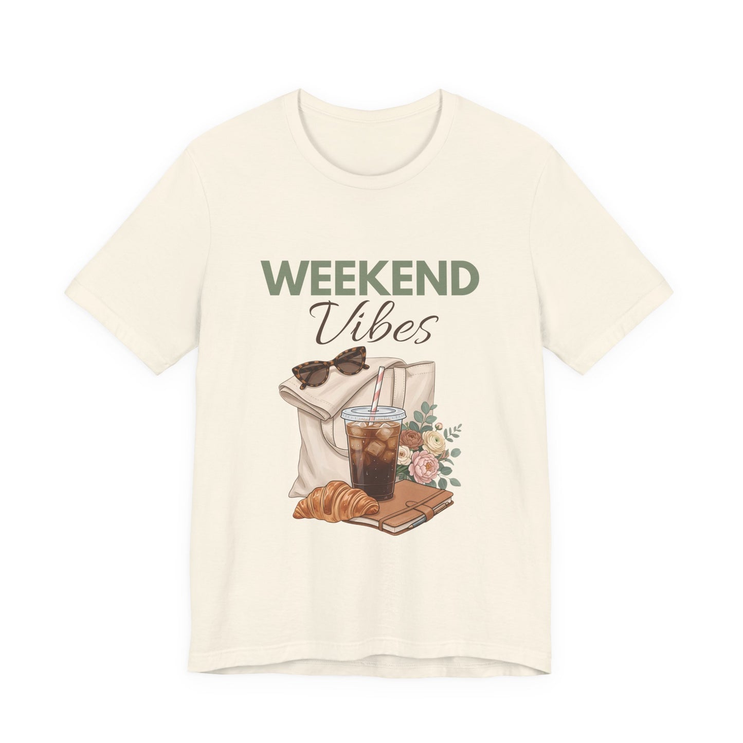 Natural colored t-shirt with 'Weekend Vibes' graphic design featuring a coffee cup, croissant, and sunglasses on a white background.