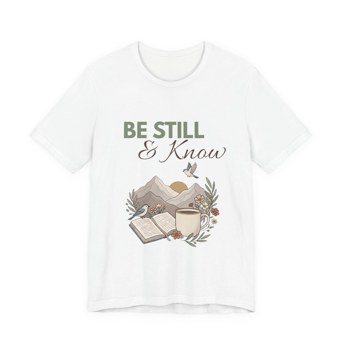 White t-shirt with 'Be Still & Know' graphic design on a white background