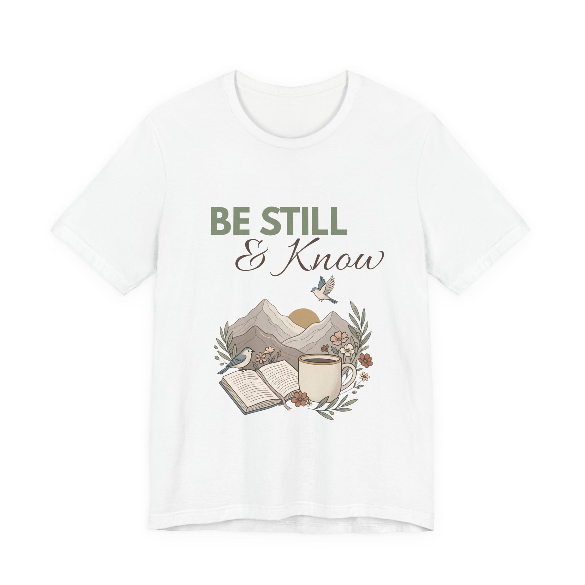 White t-shirt with 'Be Still & Know' graphic design on a white background