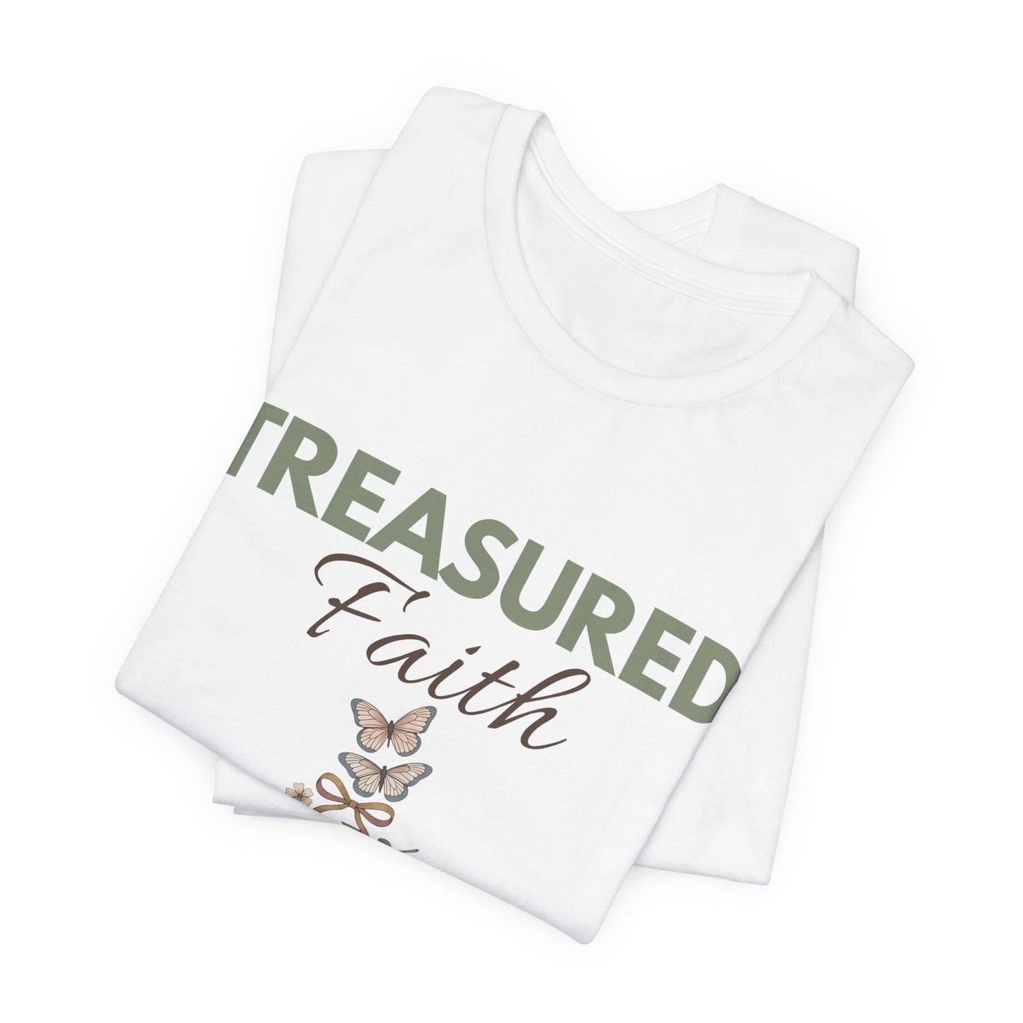 Stack of white t-shirts with 'Treasured Faith' text and butterfly design on a white background
