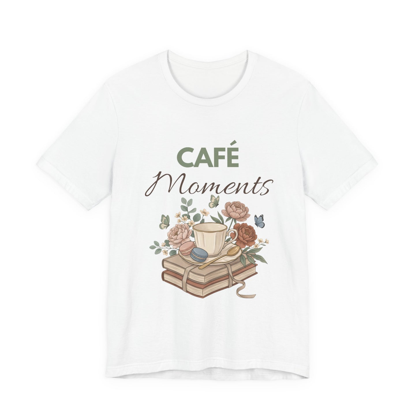 White t-shirt with 'Café Moments' design featuring a cup, books, and flowers on a white background