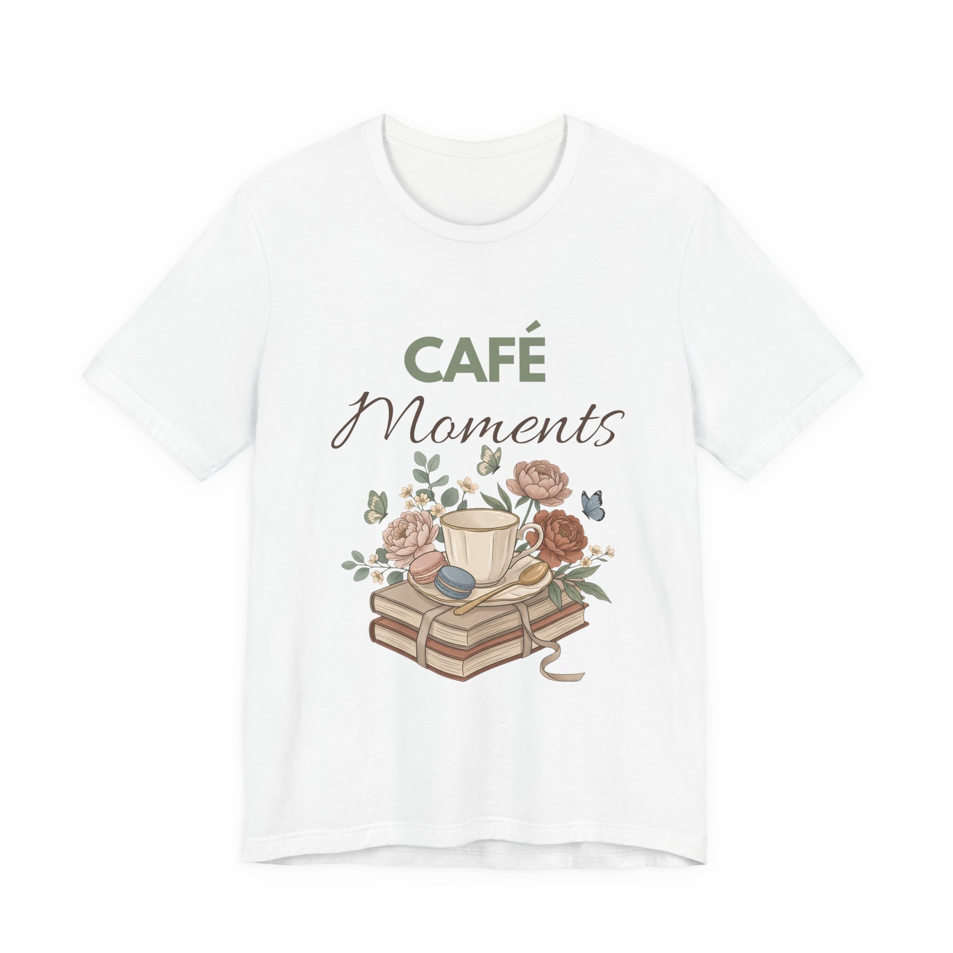 White t-shirt with 'Café Moments' design featuring a cup, books, and flowers on a white background