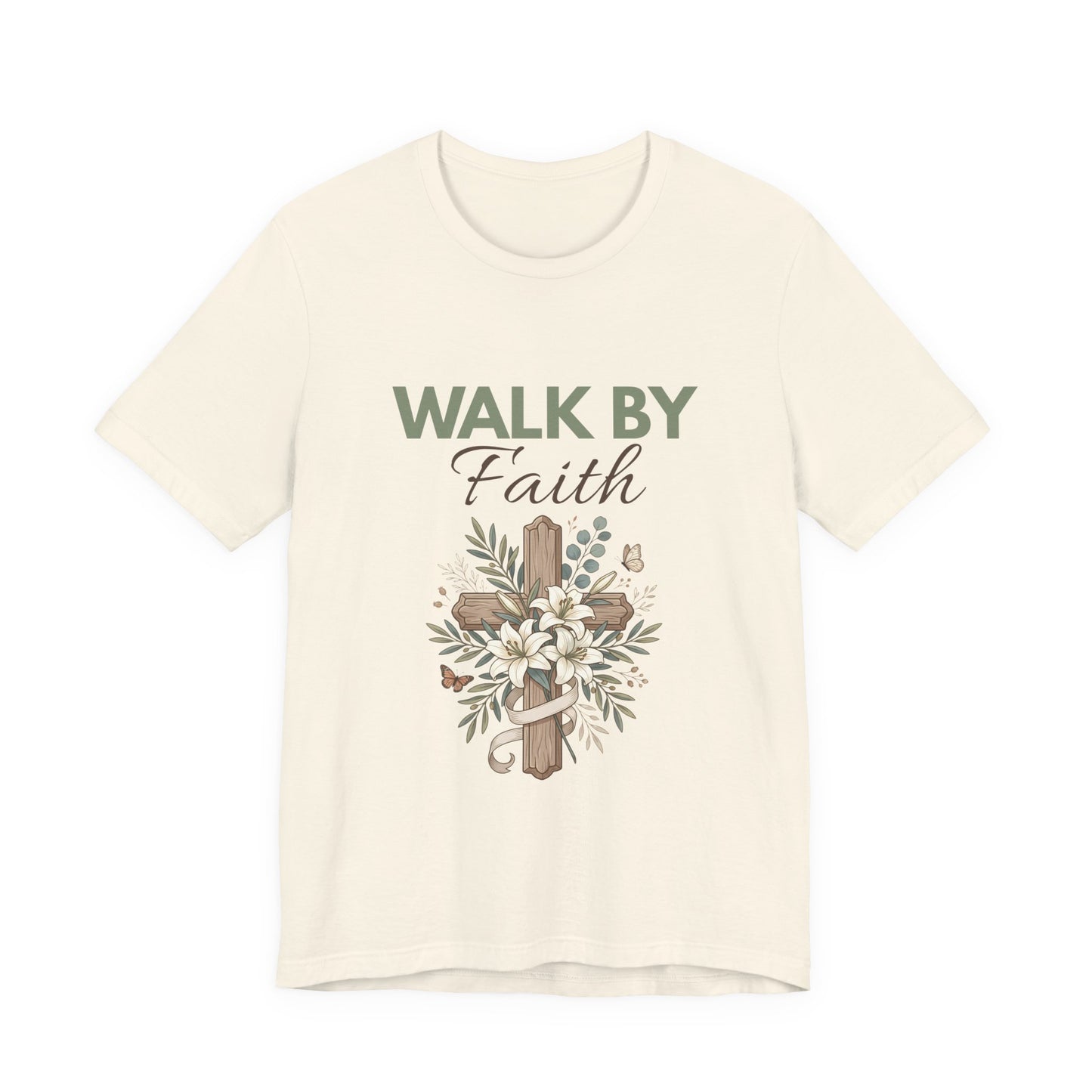 A natural-colored t-shirt with 'Walk by Faith' text and cross design on a white background