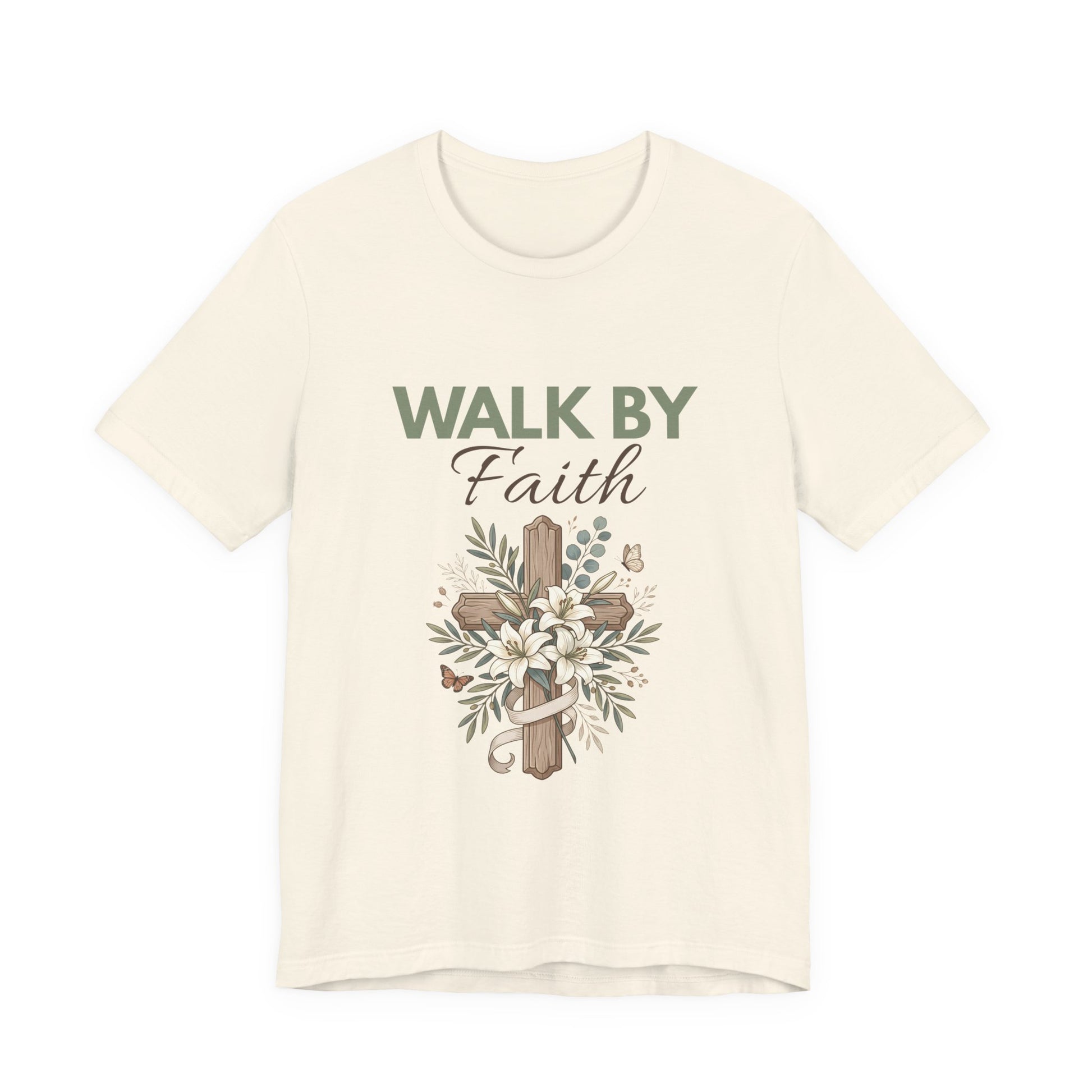 A natural-colored t-shirt with 'Walk by Faith' text and cross design on a white background