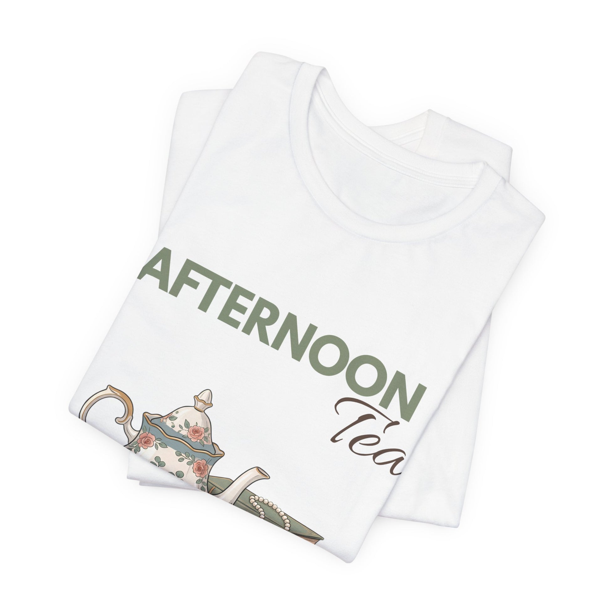 A folded white t-shirt with 'AFTERNOON Tea' on the front.