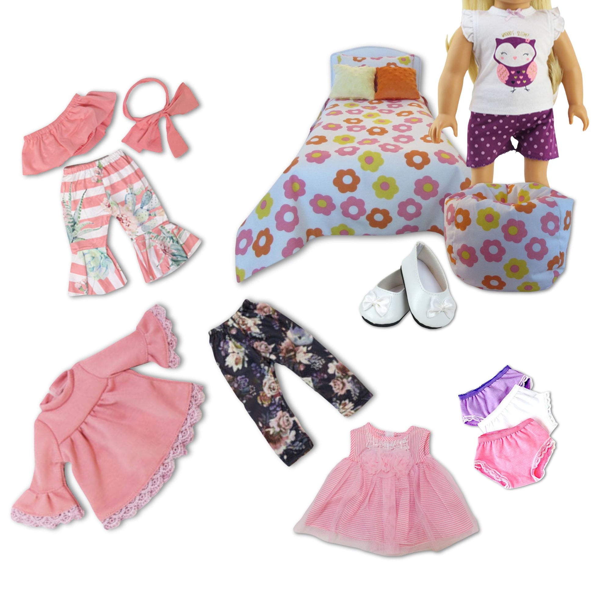 Collection of doll clothes and furniture on a white background