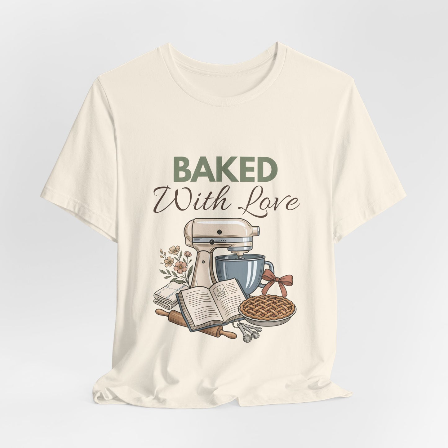 A hanging natural t-shirt with 'BAKED With Love' on the front.