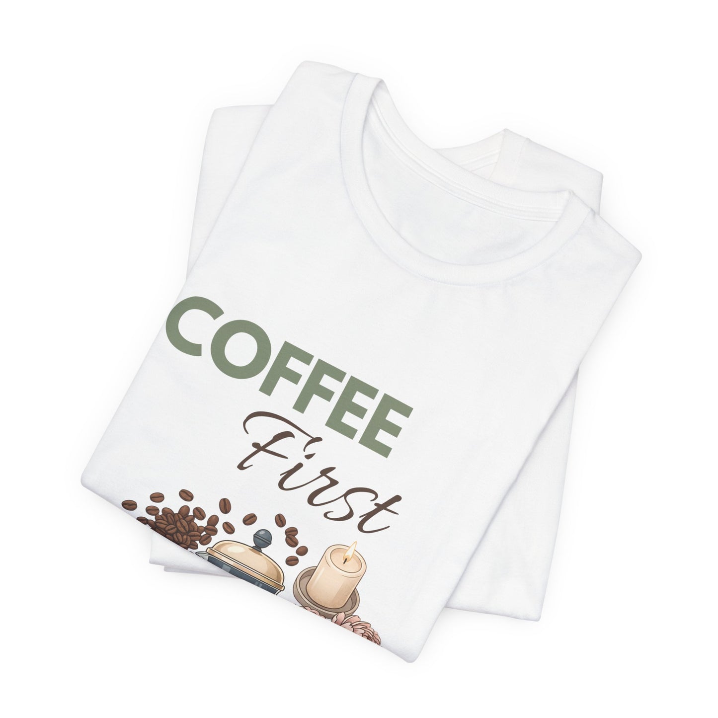 White t-shirt with 'Coffee First' text and coffee-themed graphics on a white background