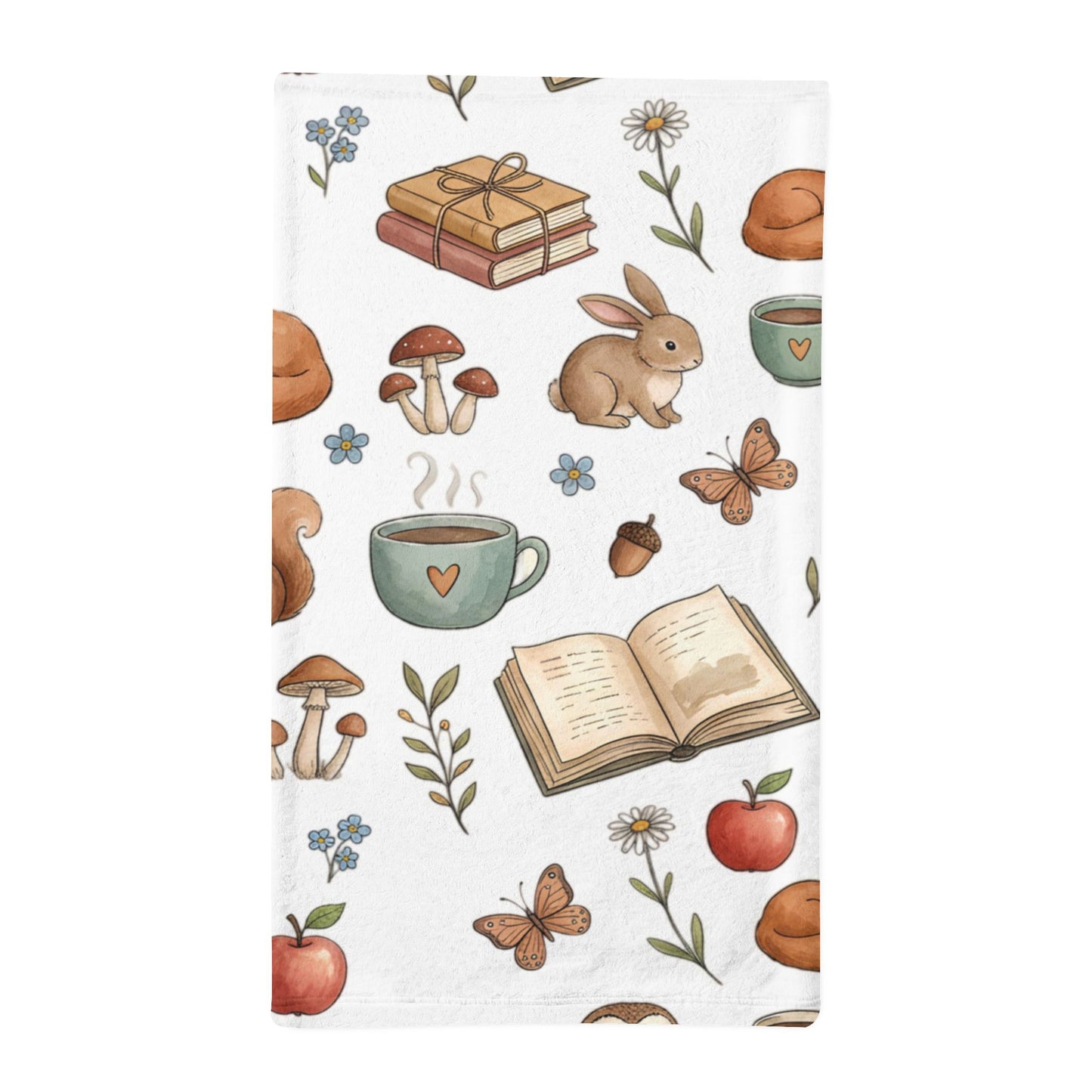 A white minky sleeping bag featuring a whimsical autumn and book-themed pattern with illustrated rabbits, mushrooms, acorns, flowers, apples, and open books.