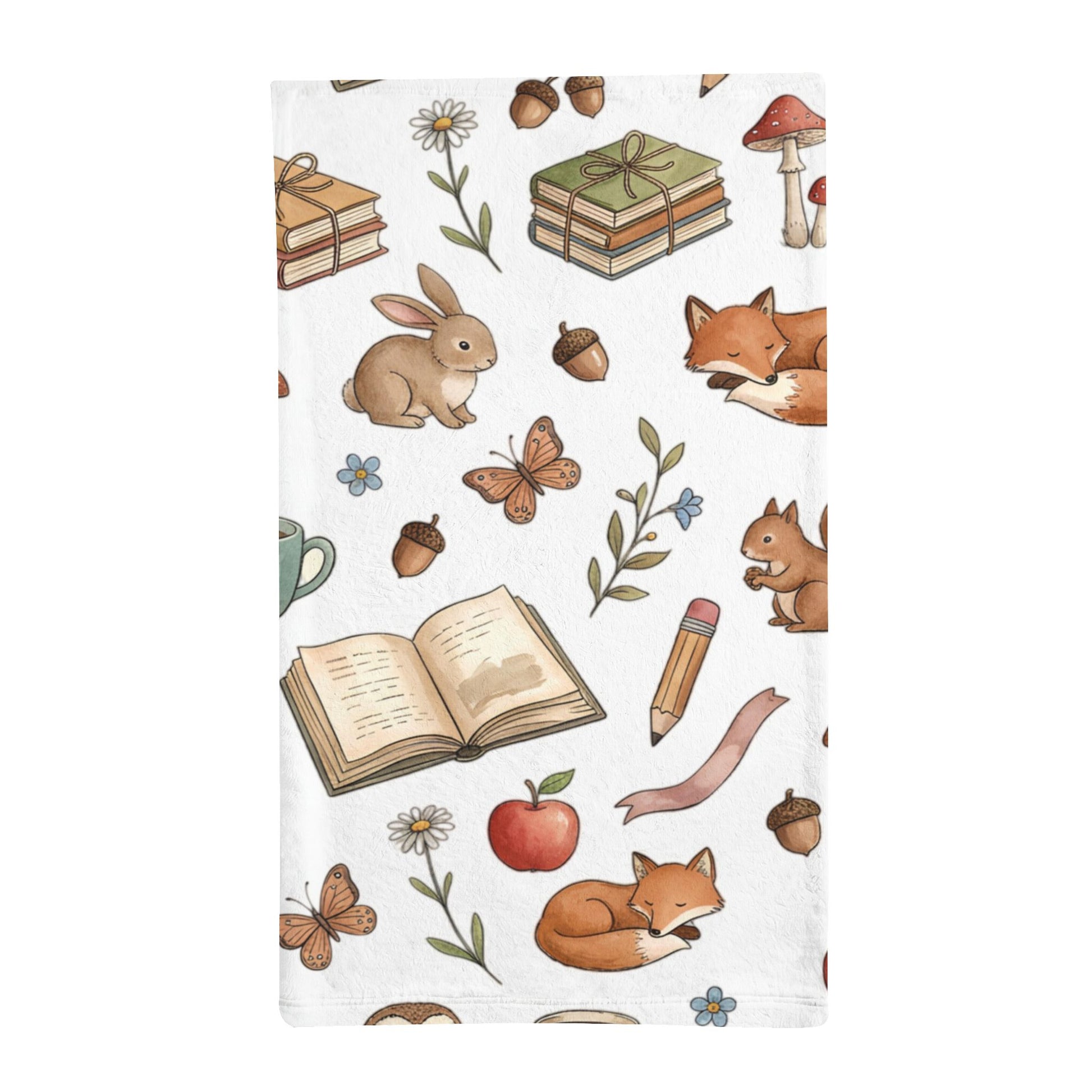 A white minky sleeping bag featuring a whimsical woodland print with illustrated foxes, rabbits, butterflies, acorns, flowers, books, a pencil, and other school-themed motifs on a clean white background.