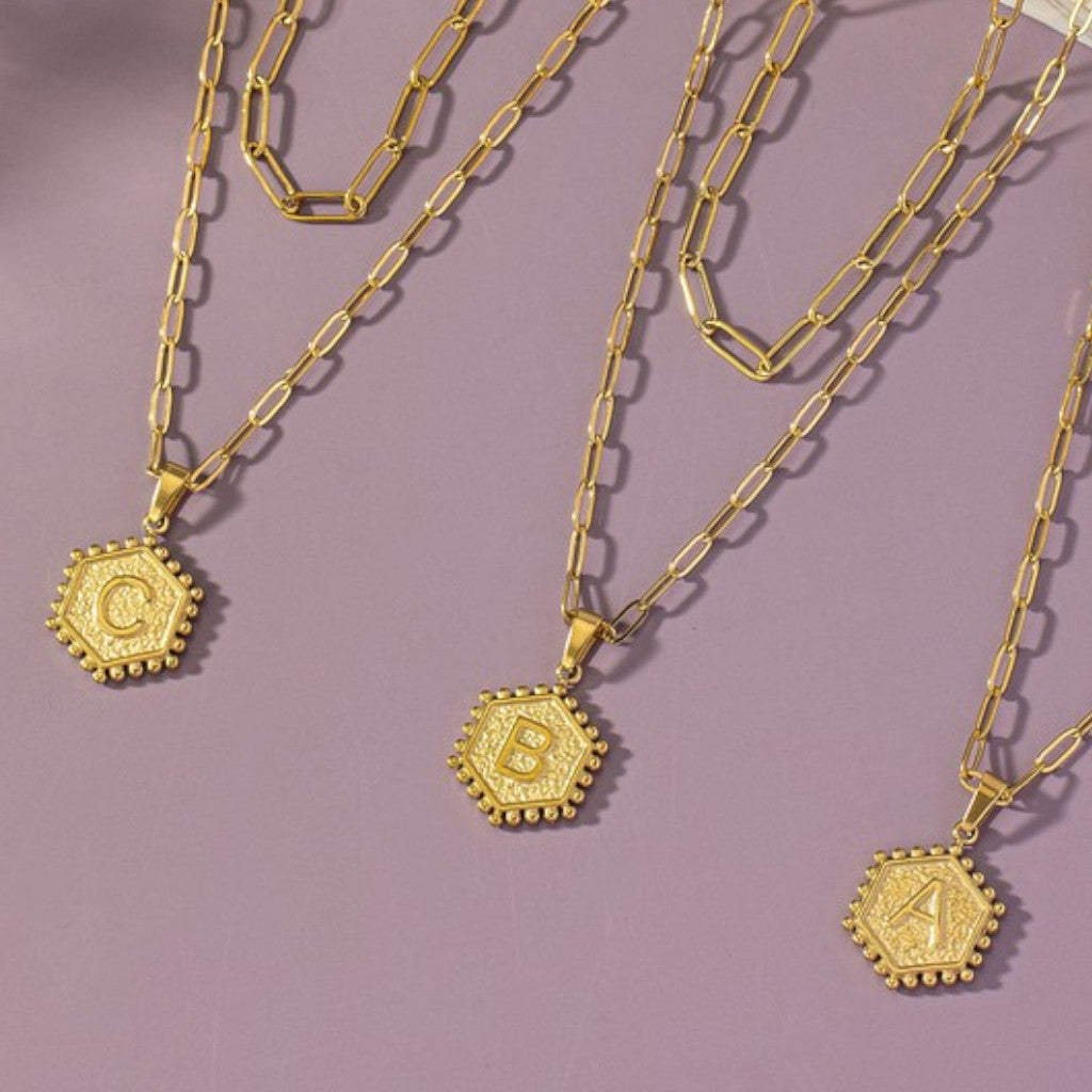 Two Row Brass Double-Sided Hexagon Initial Necklaces slanted view