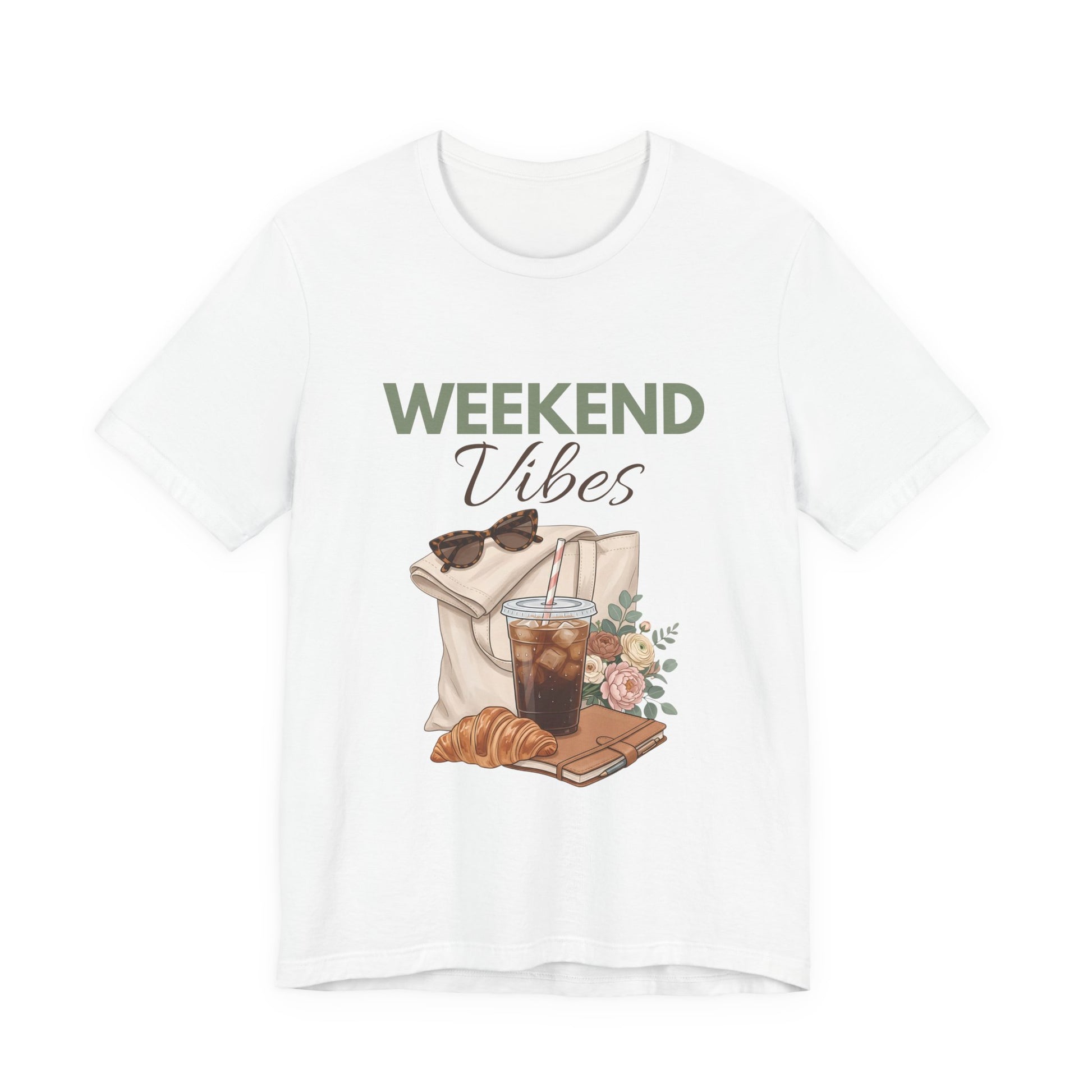 White t-shirt with 'Weekend Vibes' graphic design featuring a coffee cup, croissant, and sunglasses on a white background.
