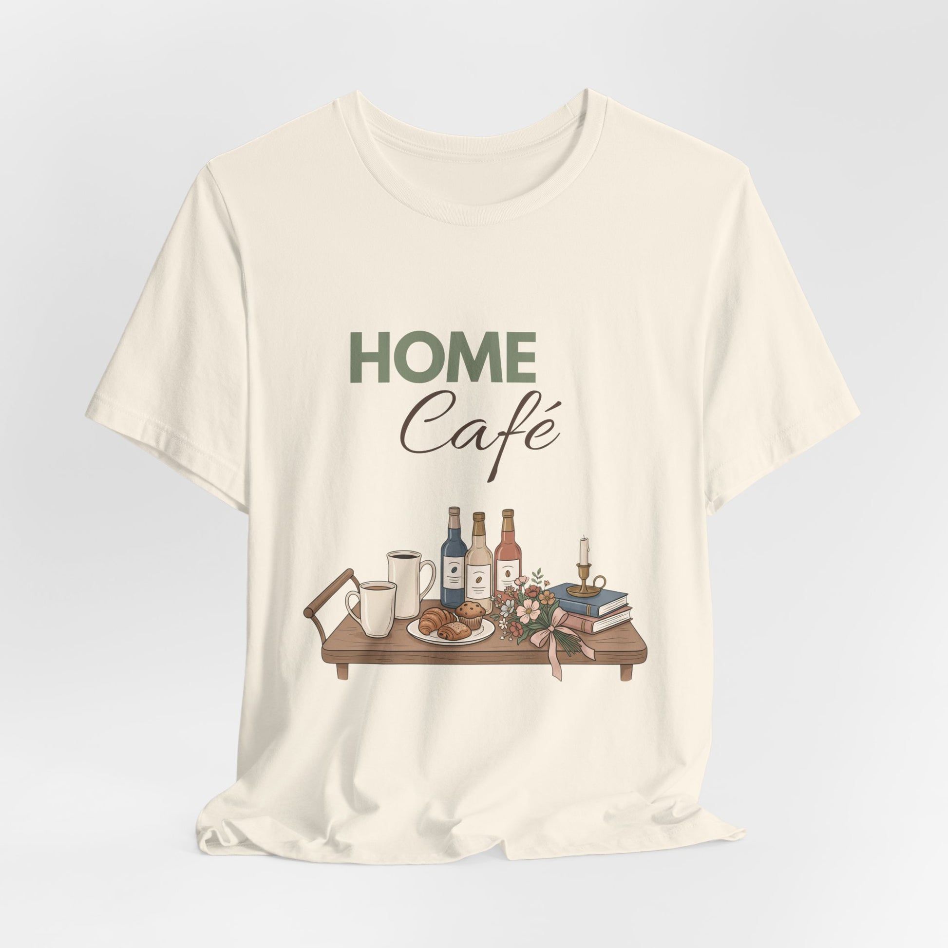 Natural colored t-shirt with 'HOME Café' graphic design on a light gray background