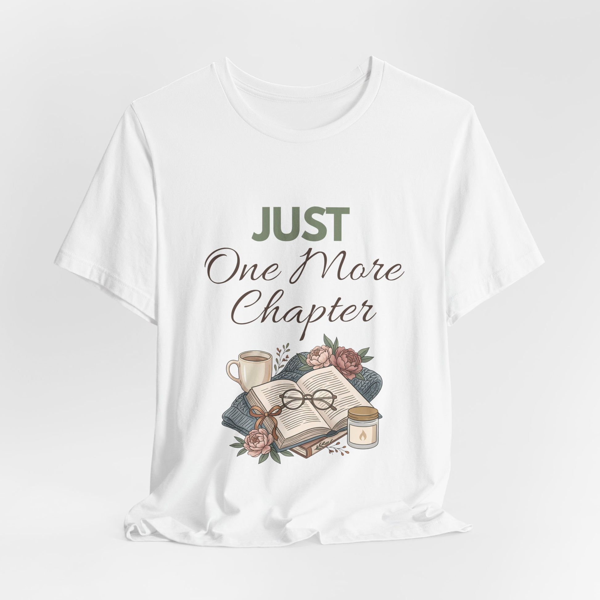 White t-shirt with 'Just One More Chapter' text and book-themed graphics on a white background