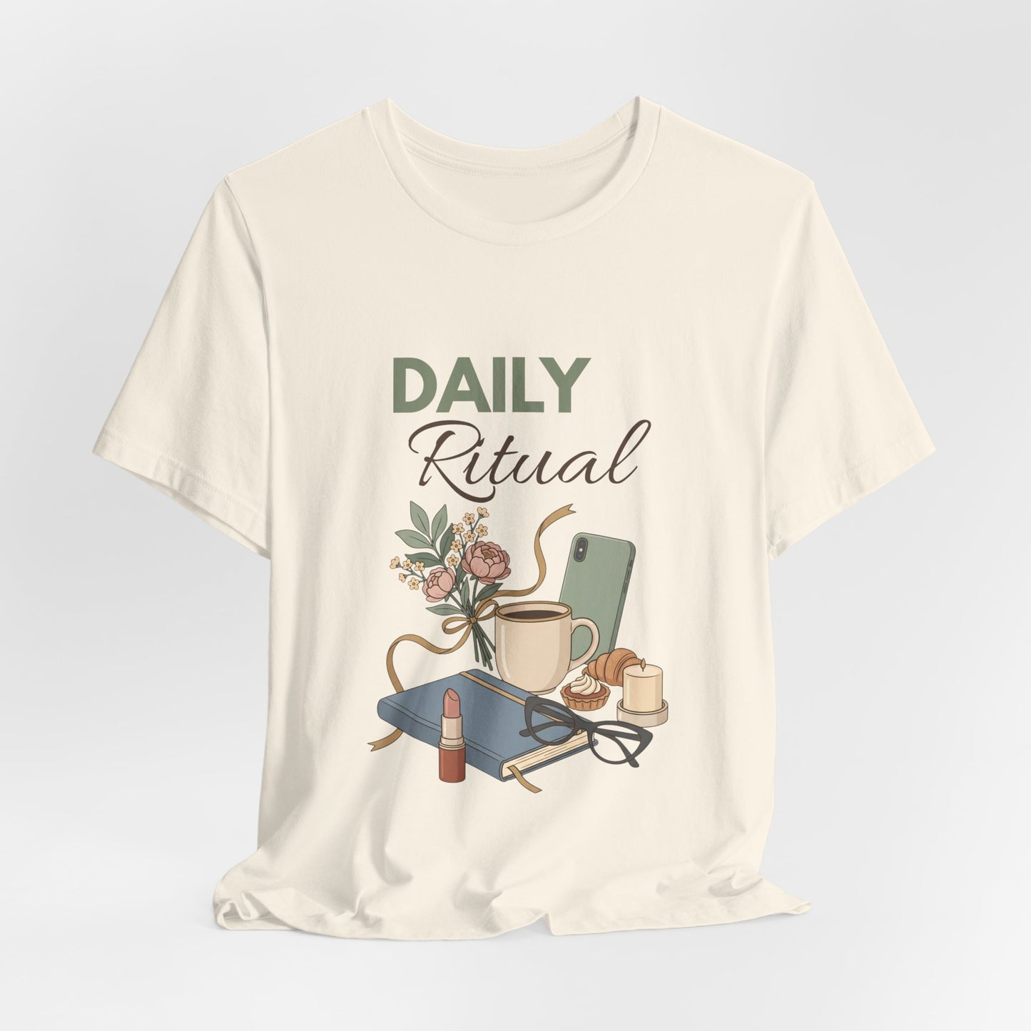 Natural colored t-shirt with 'Daily Ritual' graphic design on a light gray background