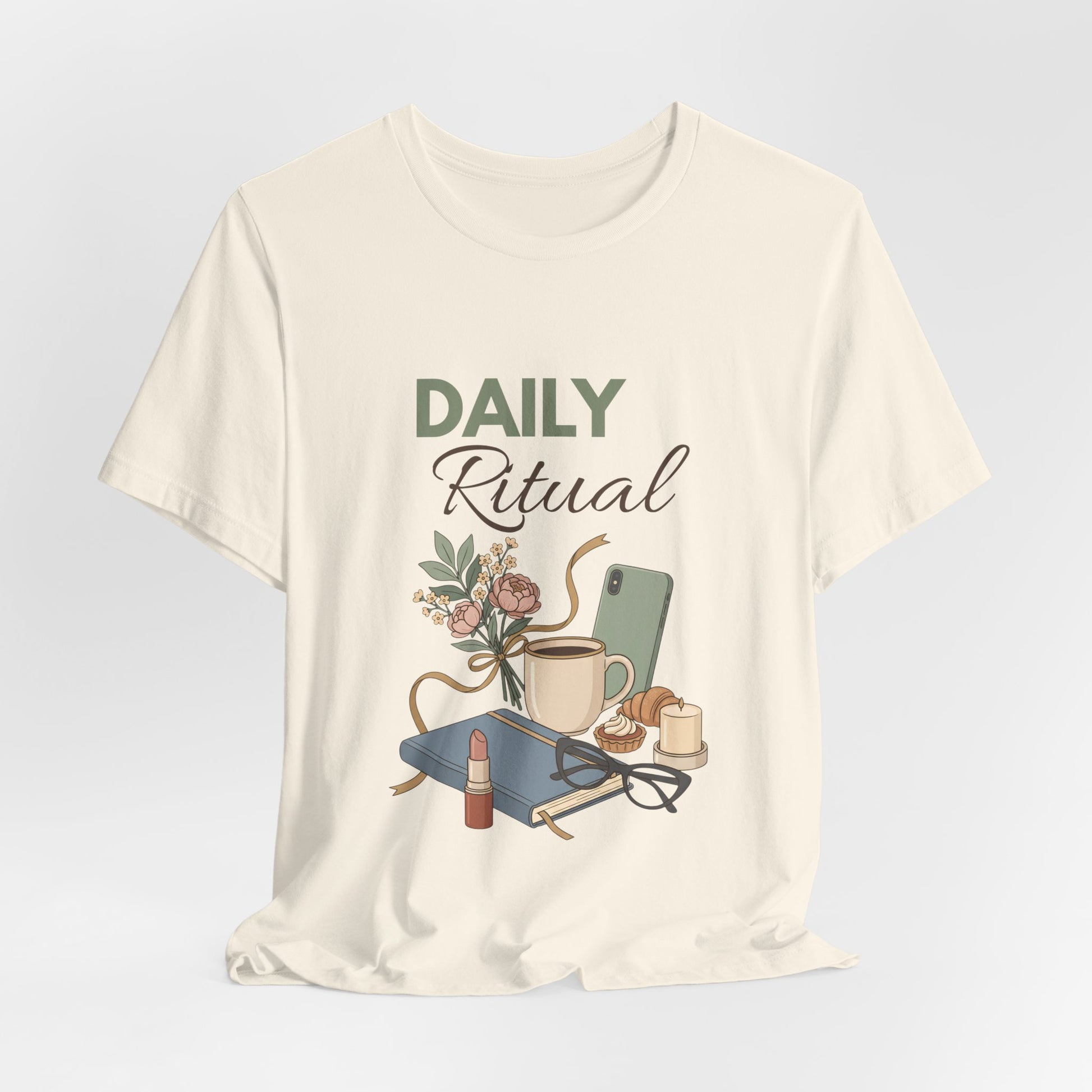 Natural colored t-shirt with 'Daily Ritual' graphic design on a light gray background