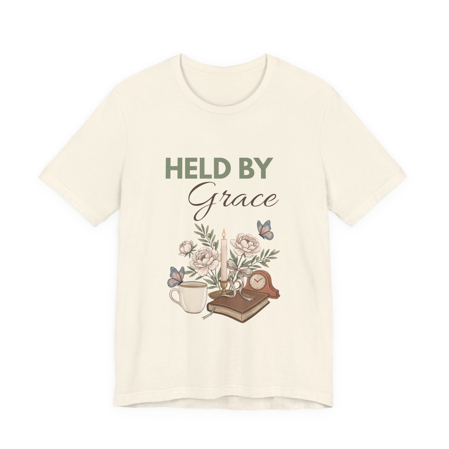 Natural colored t-shirt with 'HELD BY Grace' text and floral design on a white background