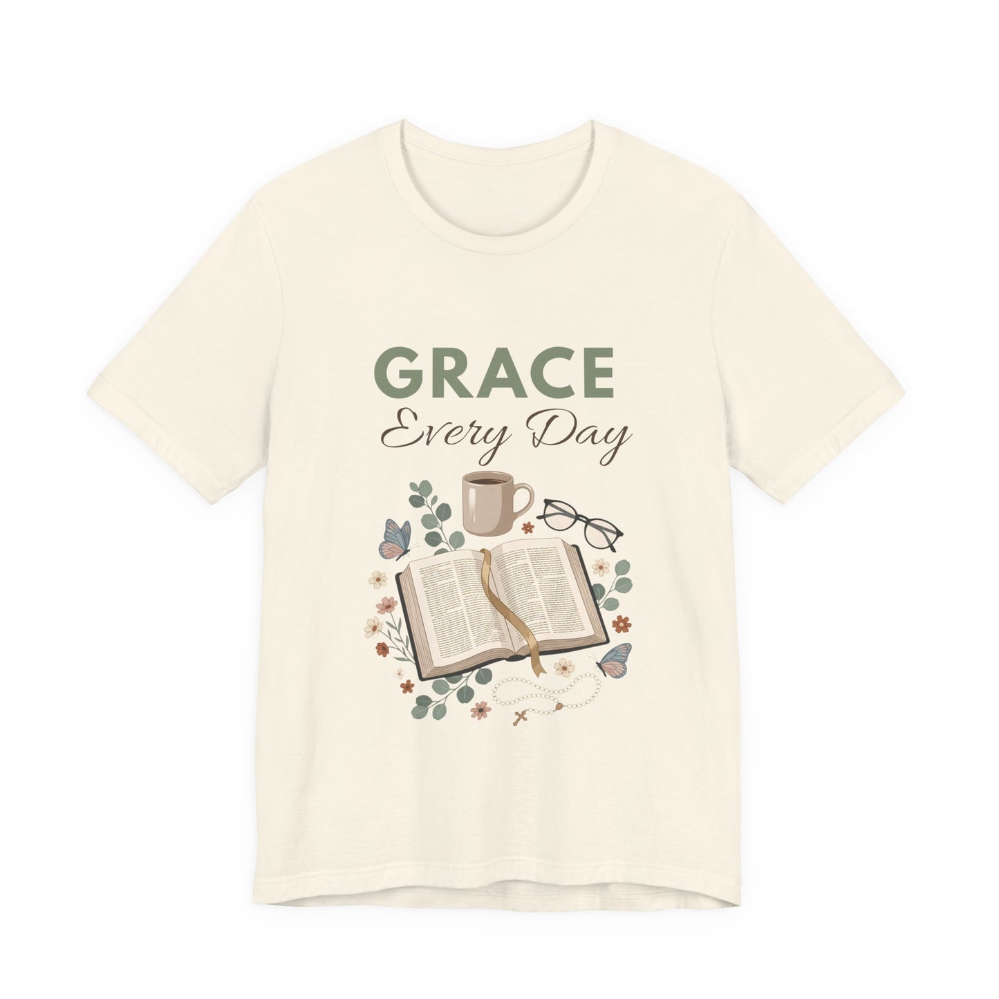 A natural colored t-shirt with 'Grace Every Day' text and book graphic on a white background
