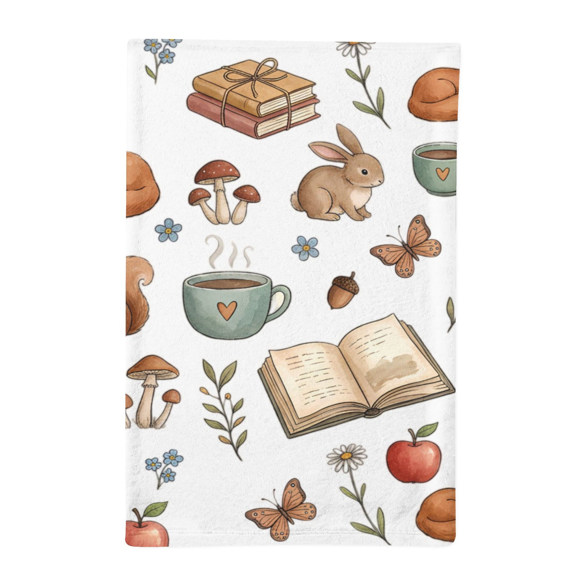 A white minky sleeping bag featuring a whimsical autumn-themed illustration pattern with a rabbit, mushrooms, acorns, butterflies, an open book, and steaming mugs on a white background.