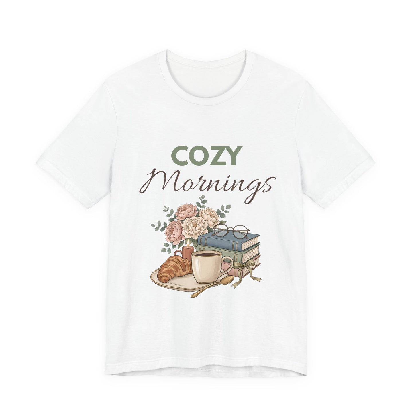 White t-shirt with 'Cozy Mornings' graphic featuring a cup, croissant, and books on a white background