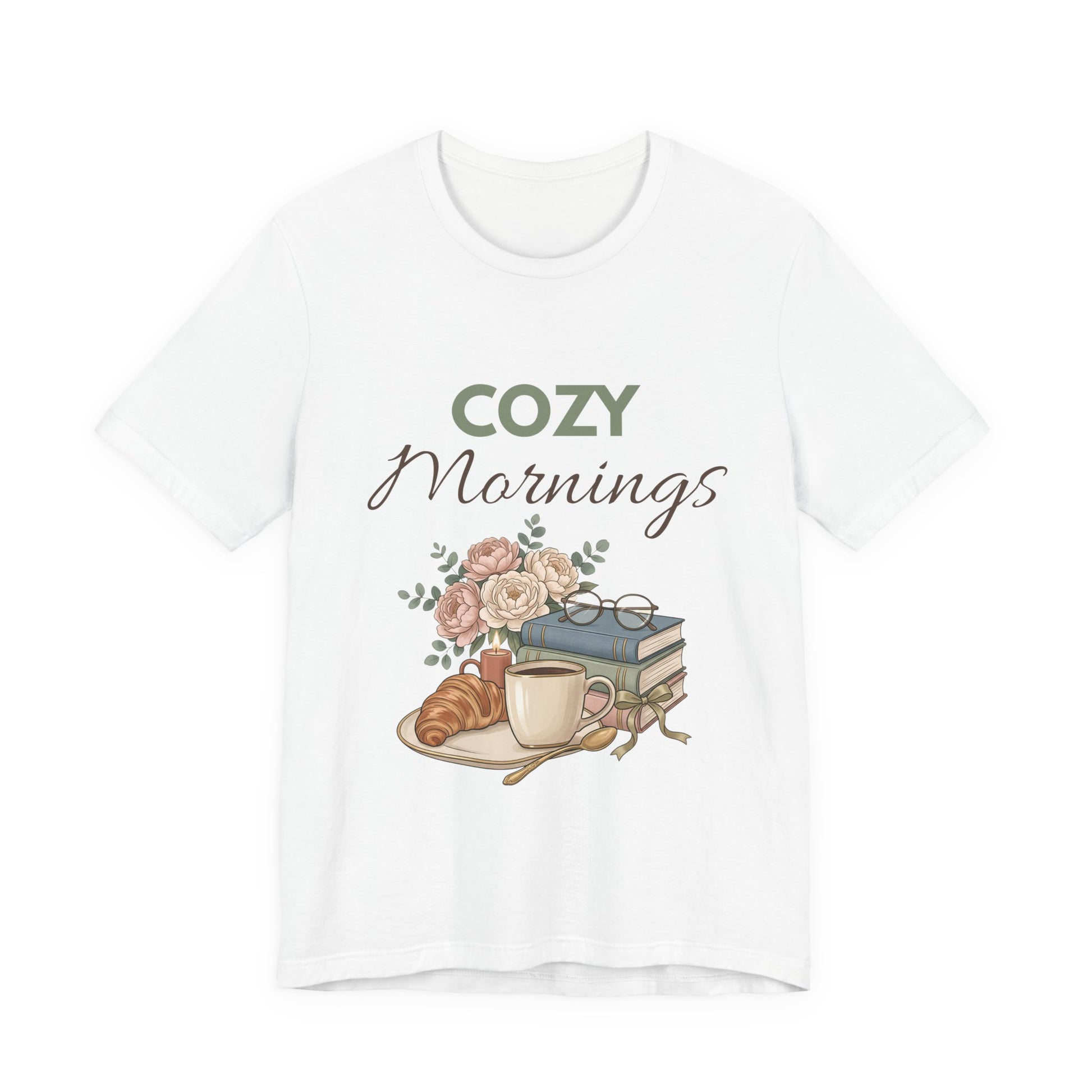 White t-shirt with 'Cozy Mornings' graphic featuring a cup, croissant, and books on a white background