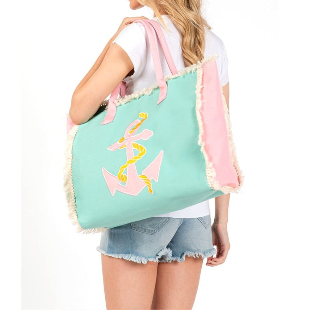 A woman holding an Anchor Fringe Oversized Fashion Tote Side view